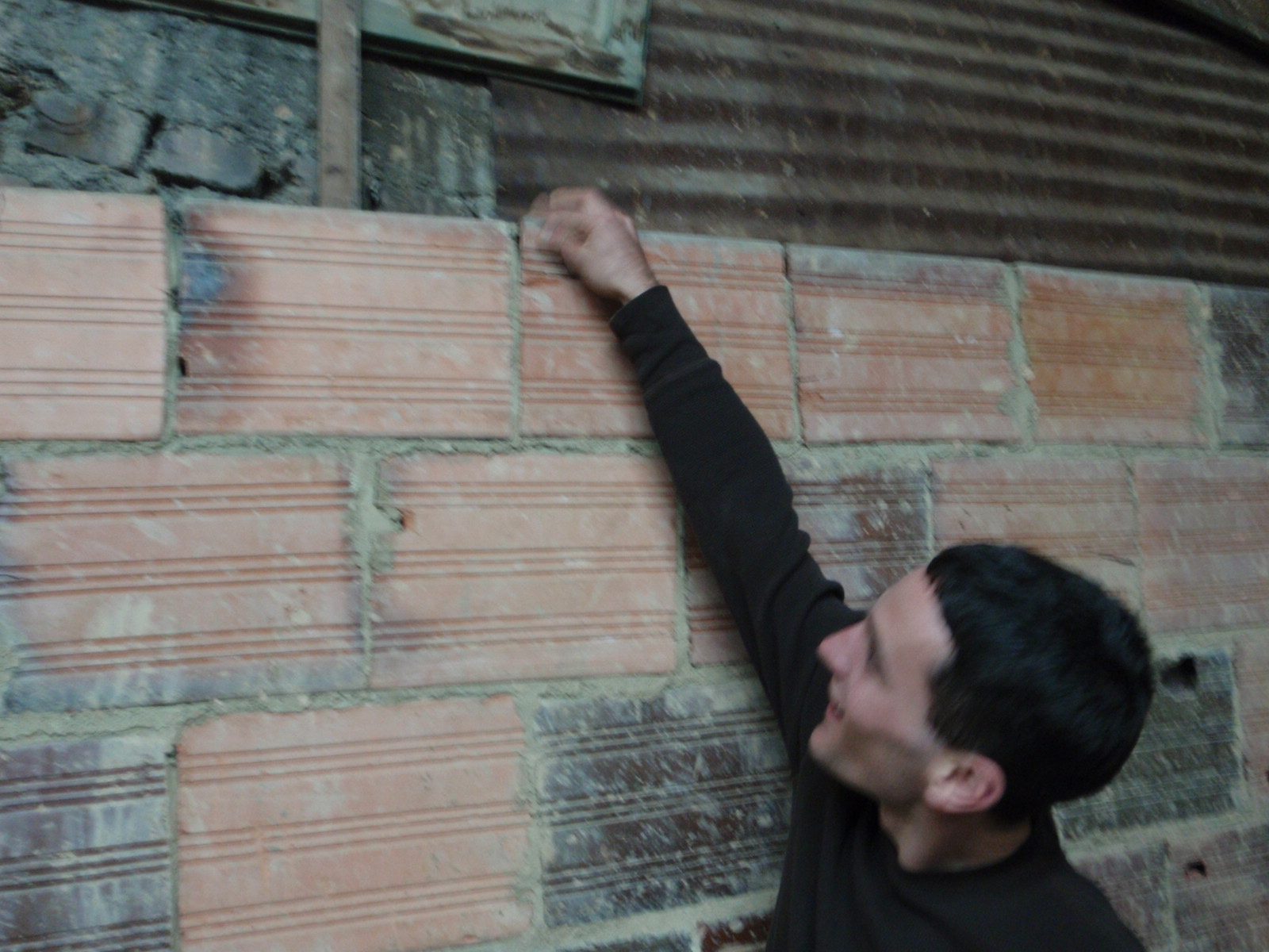 Vinnie destroyed part of their brick wall with a mis-aimed shot.