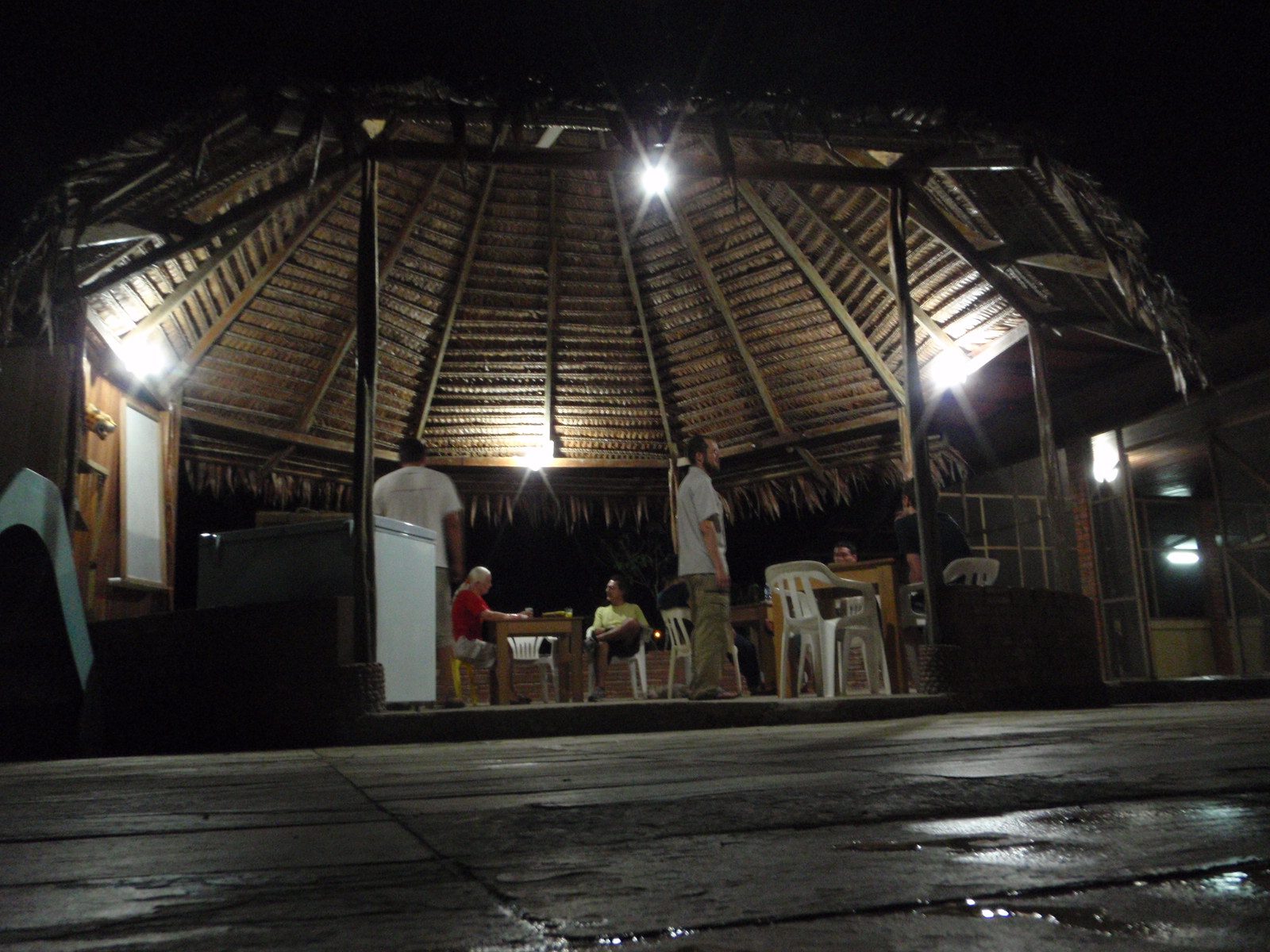 Joel, Vinnie and Monica relaxing at night at our jungle hostel outside Leticia.