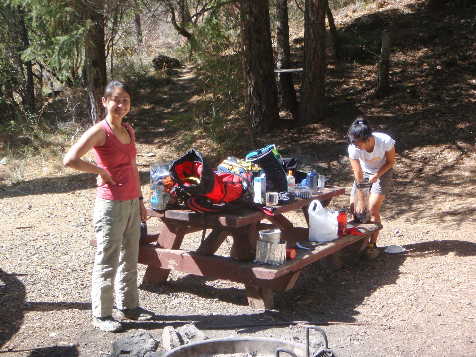 Monica at our breakfast table, while Christina preps her dry bag for the day's outing.