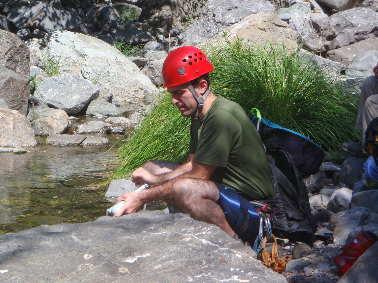 Chris pumps us some water from Rattlesnake Creek.