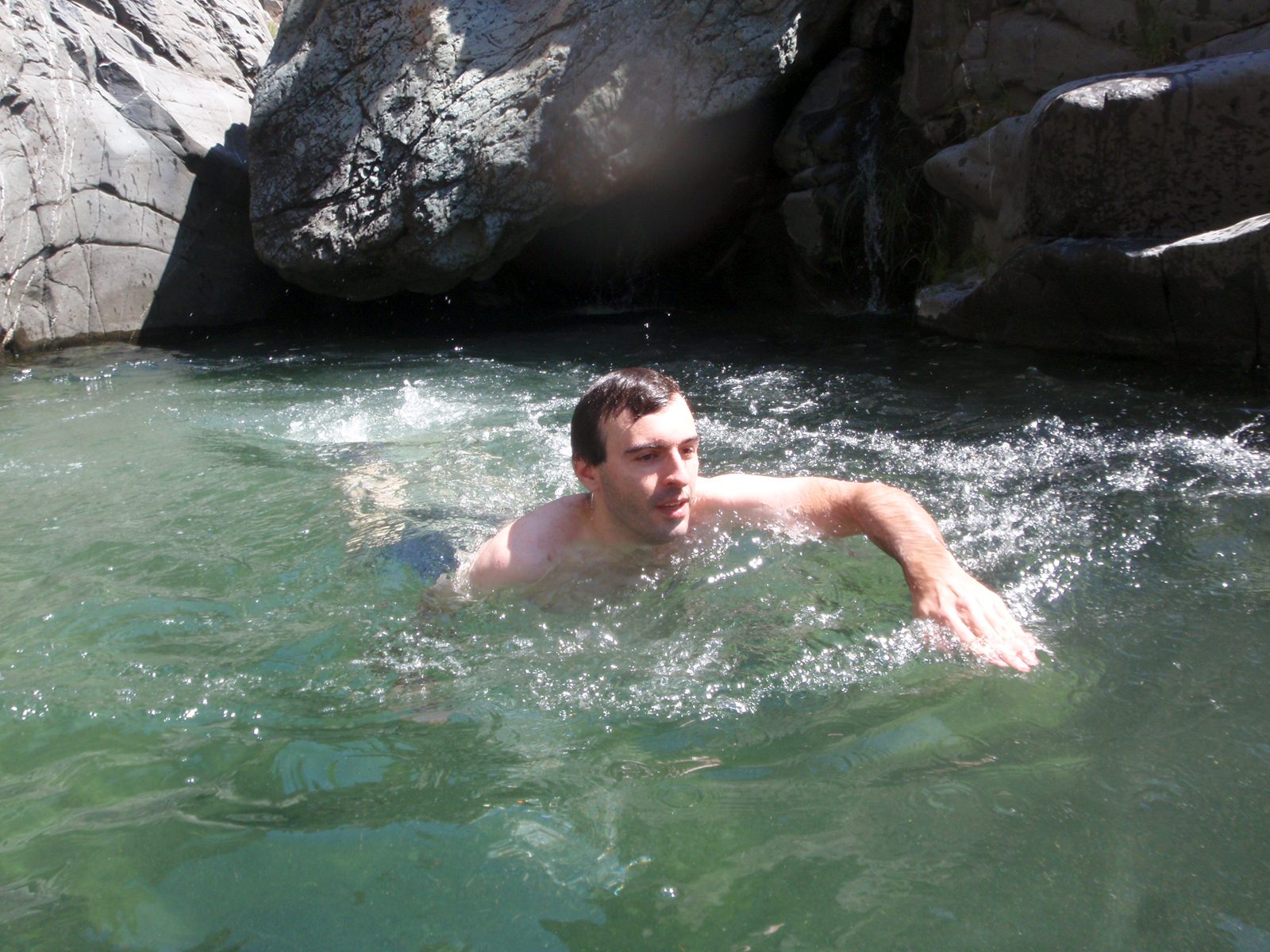 Chris, swimming for shore in the first pool we encountered in Conda Coolero.