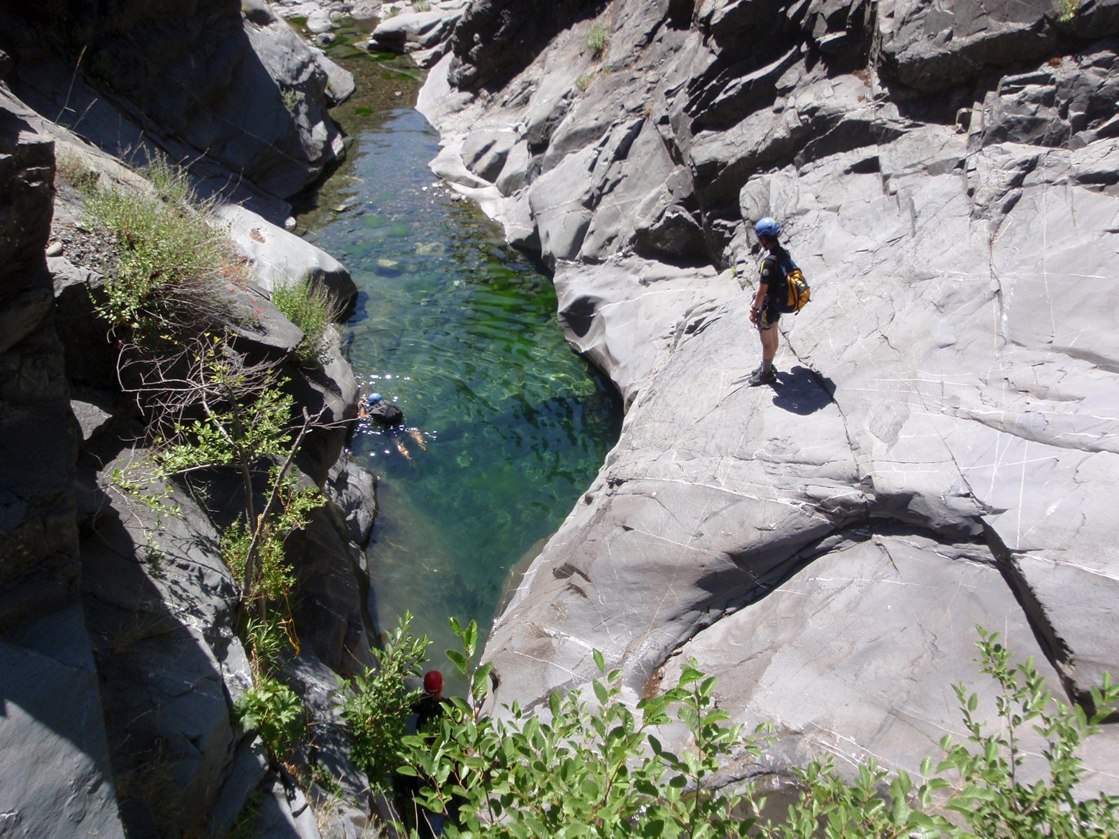 Monica thinks about maybe jumping while Christina swims for shore on the left and Chris (red...