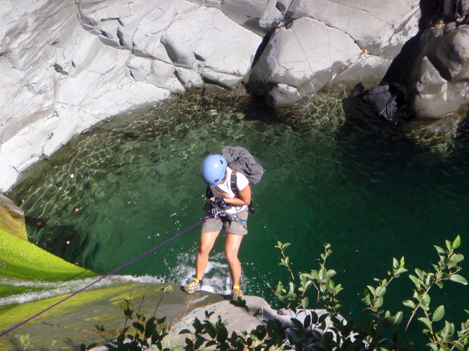 Christina, standing at the edge of the waterfall.