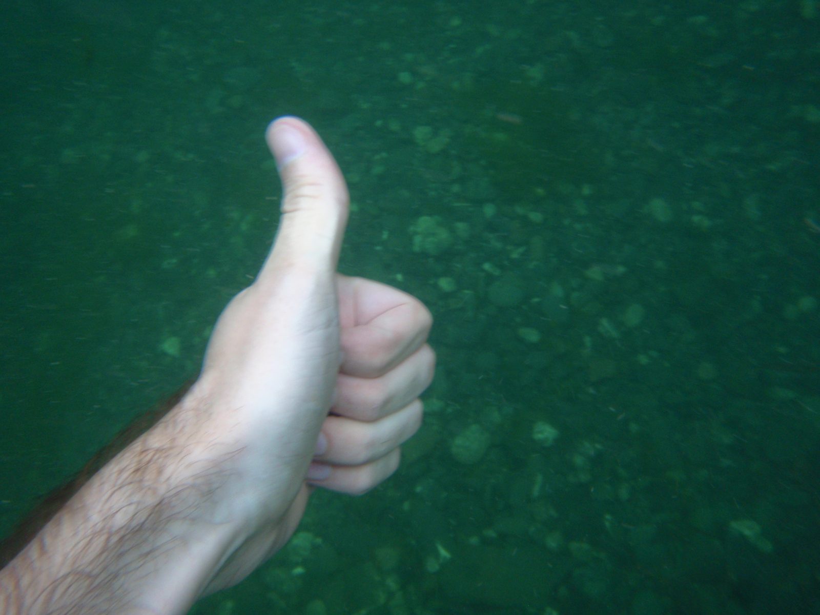 Thumbs up!  Chris's left hand.  I guess this is the bottom of the pool?