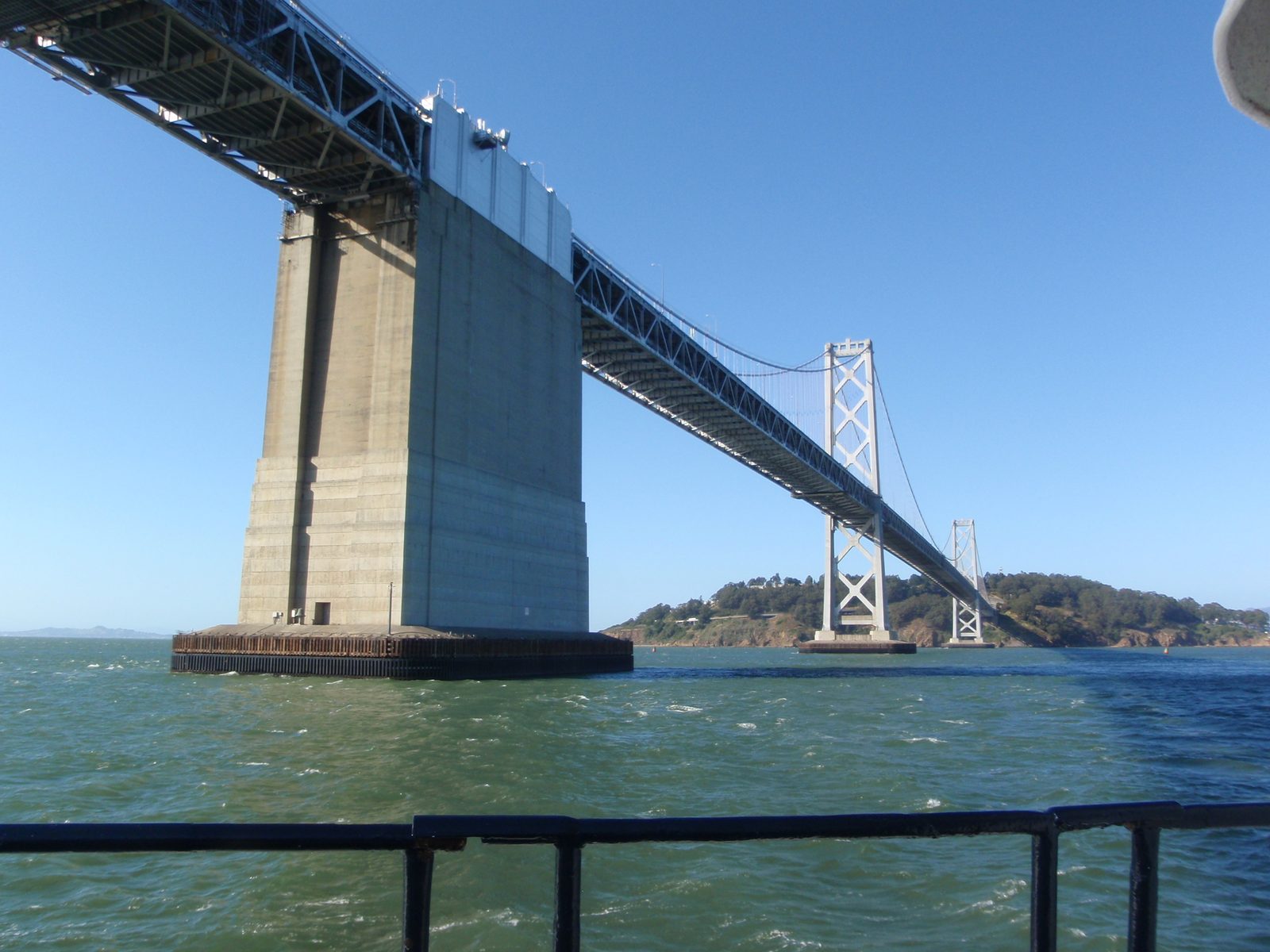 Old Bay Bridge with Yerba Buena Island in the background.