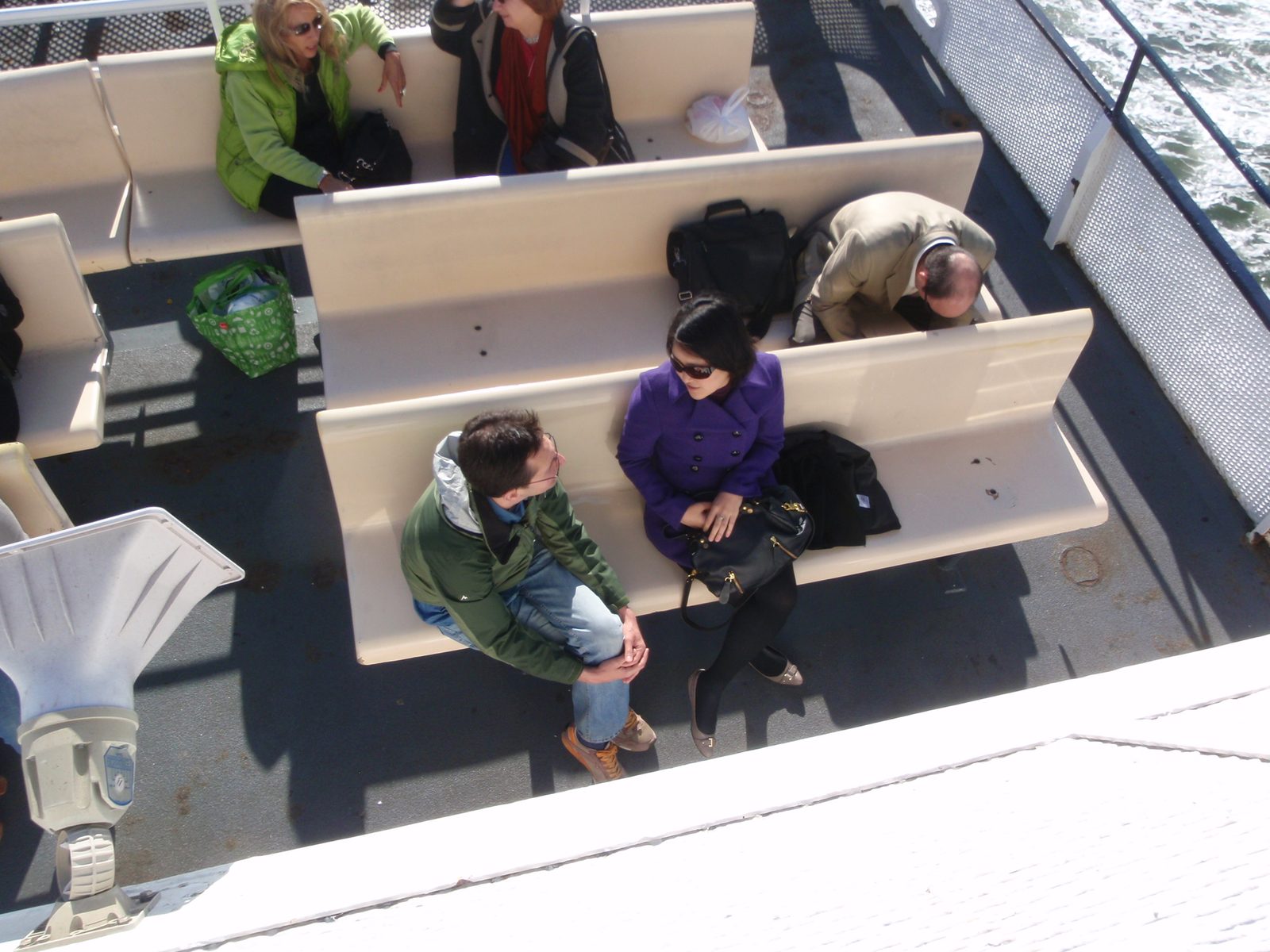 Rob and Monica talking on the ferry. Rob just bought a condo, I'm guessing that's what they're...