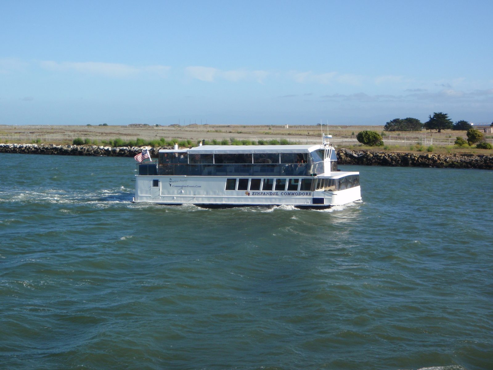 Entering Oakland Harbor. The decommissioned Alameda Naval Air Station is in the background. It's...