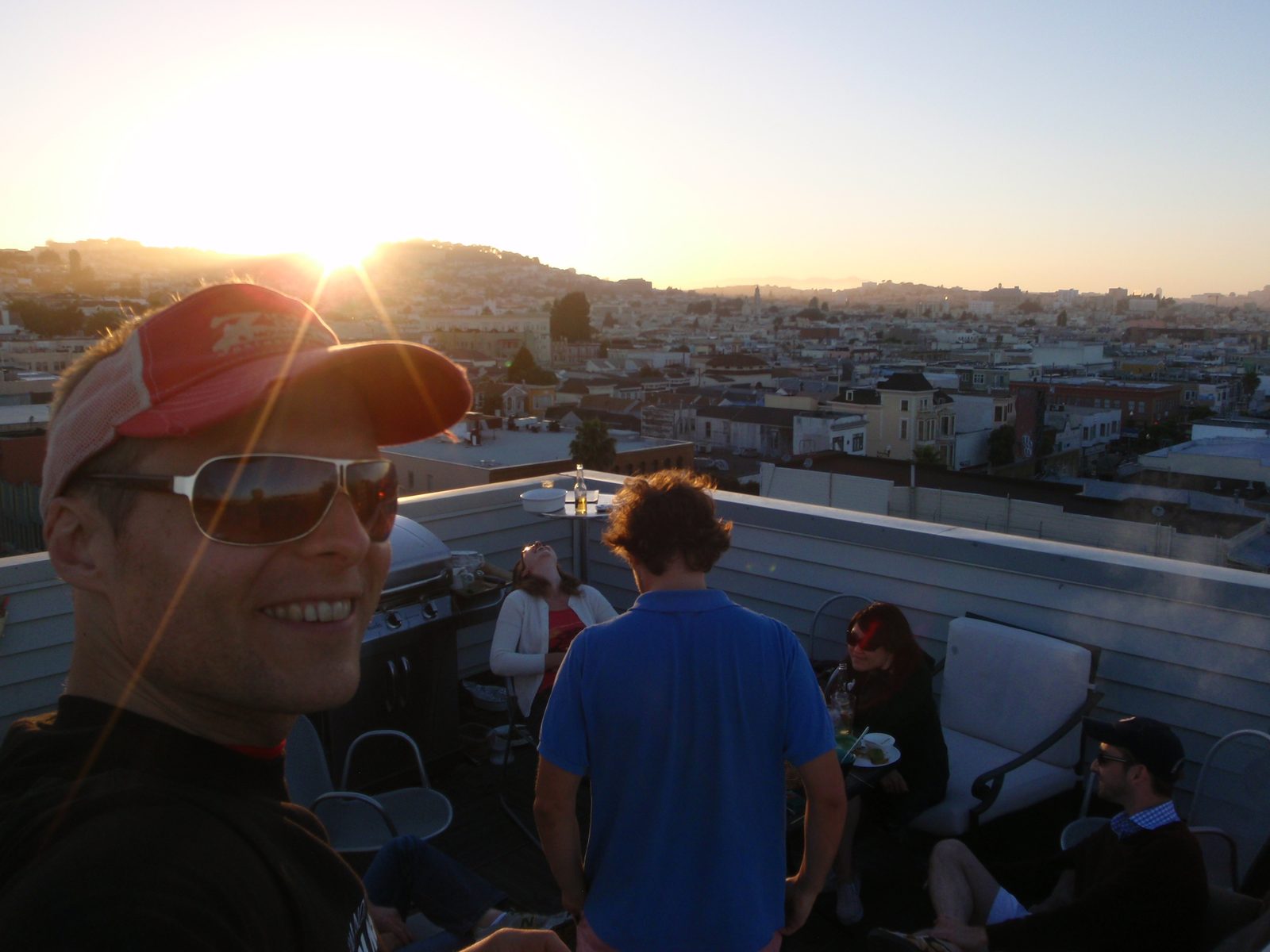 John taking a self portrait at our barbecue as the sun sets. 