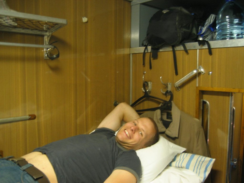 John, relaxing in our train cabin.