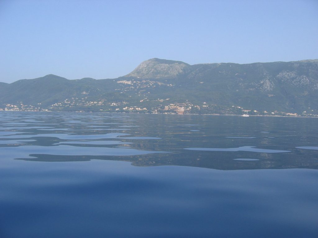 View from my scuba diving boat my first day in Corfu.  I believe the mountain in the center of...