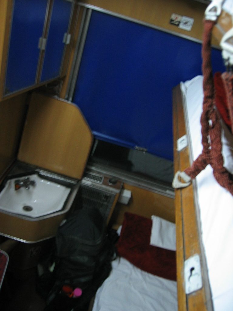 My private overnight train cabin with 2 beds, plus a half size kiddie bed, sink with running...