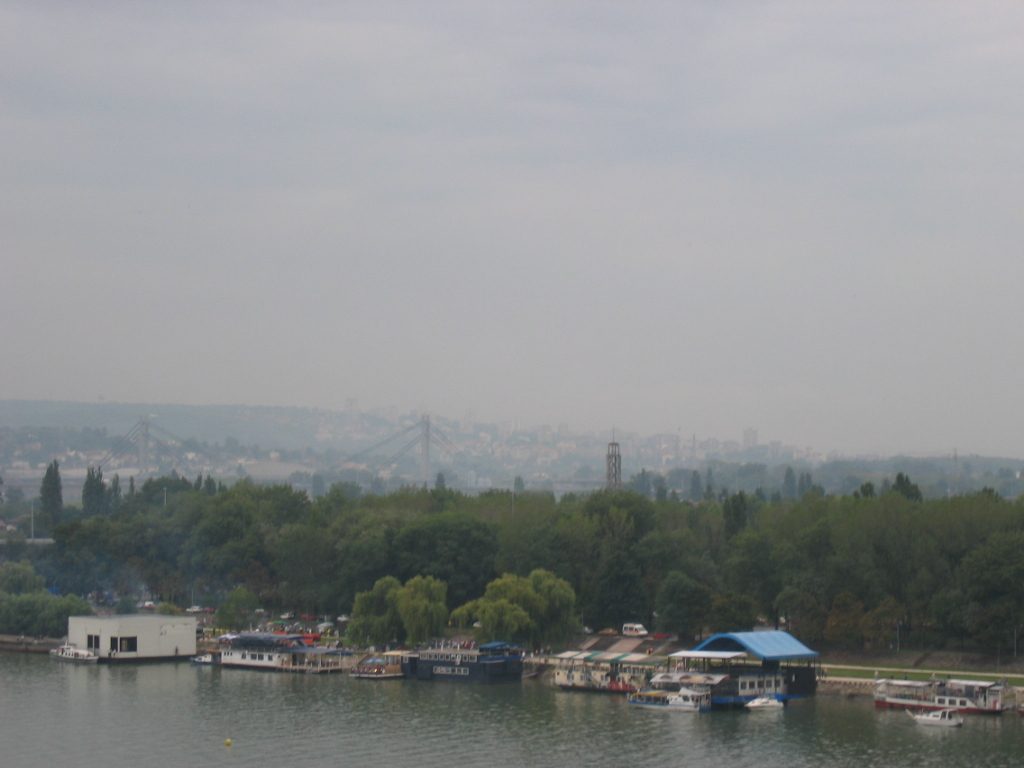 Belgrade with a susension bridge faintly visible crossing the Danube.