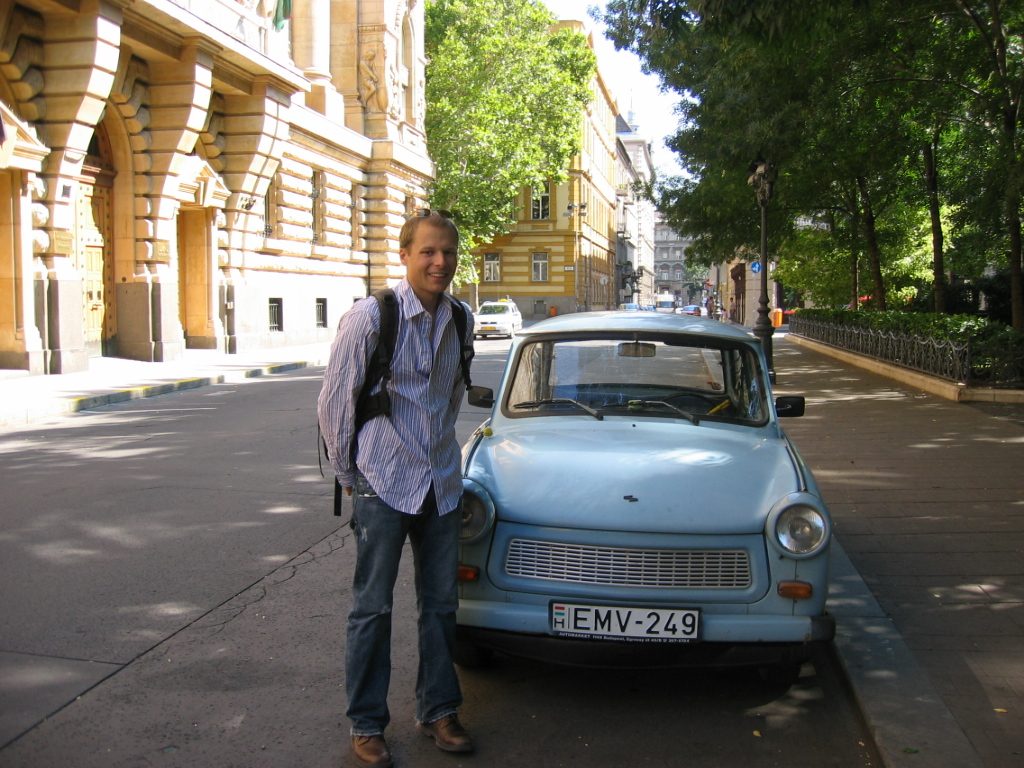 John and a Trabant.  These things were all over the place in Budapest.  (For those of you...