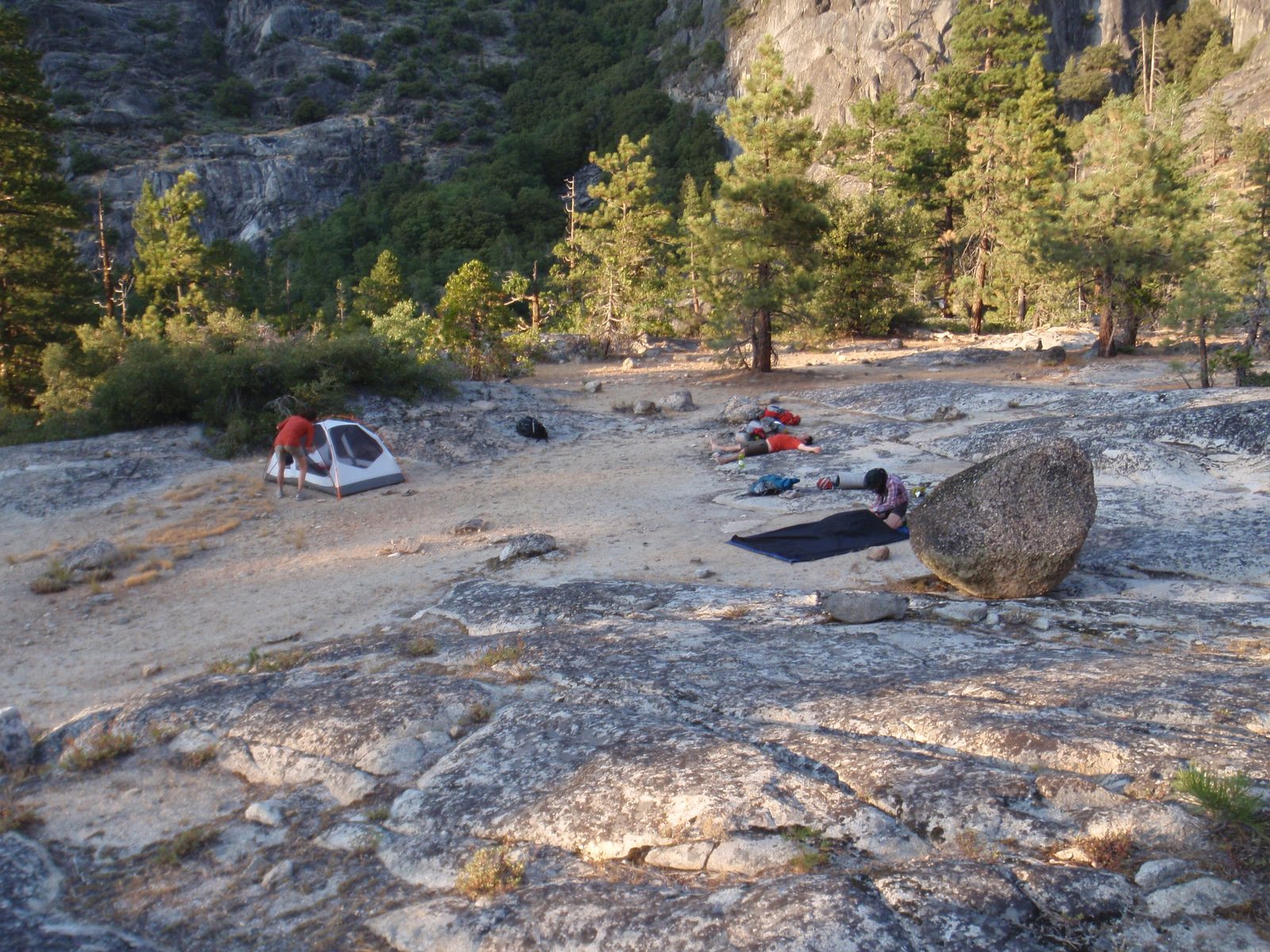 View of our campsite: Mel sets up Jasper and Mel's tent while Monica lays out John and Monica's...