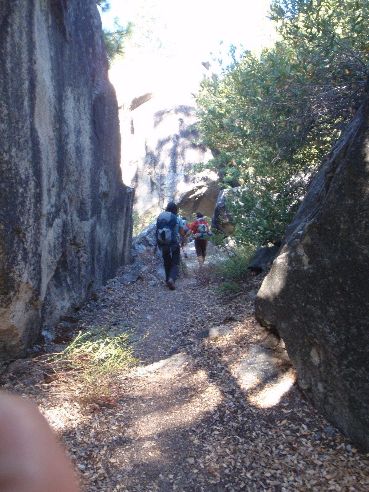 Marching down through some boulders.