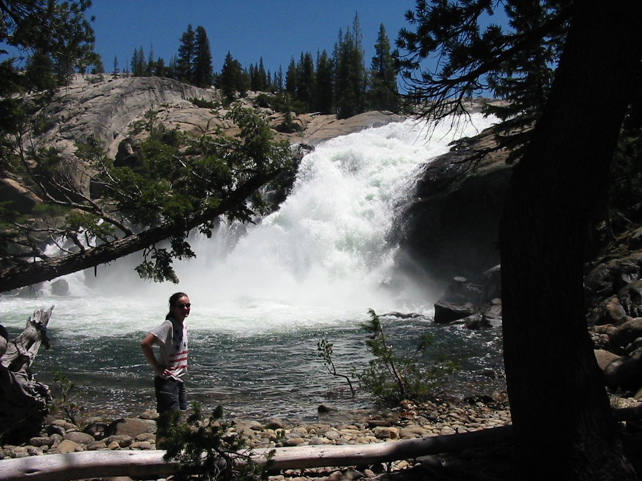 Rachel in front of the Tuolumne river near the flooded campground.