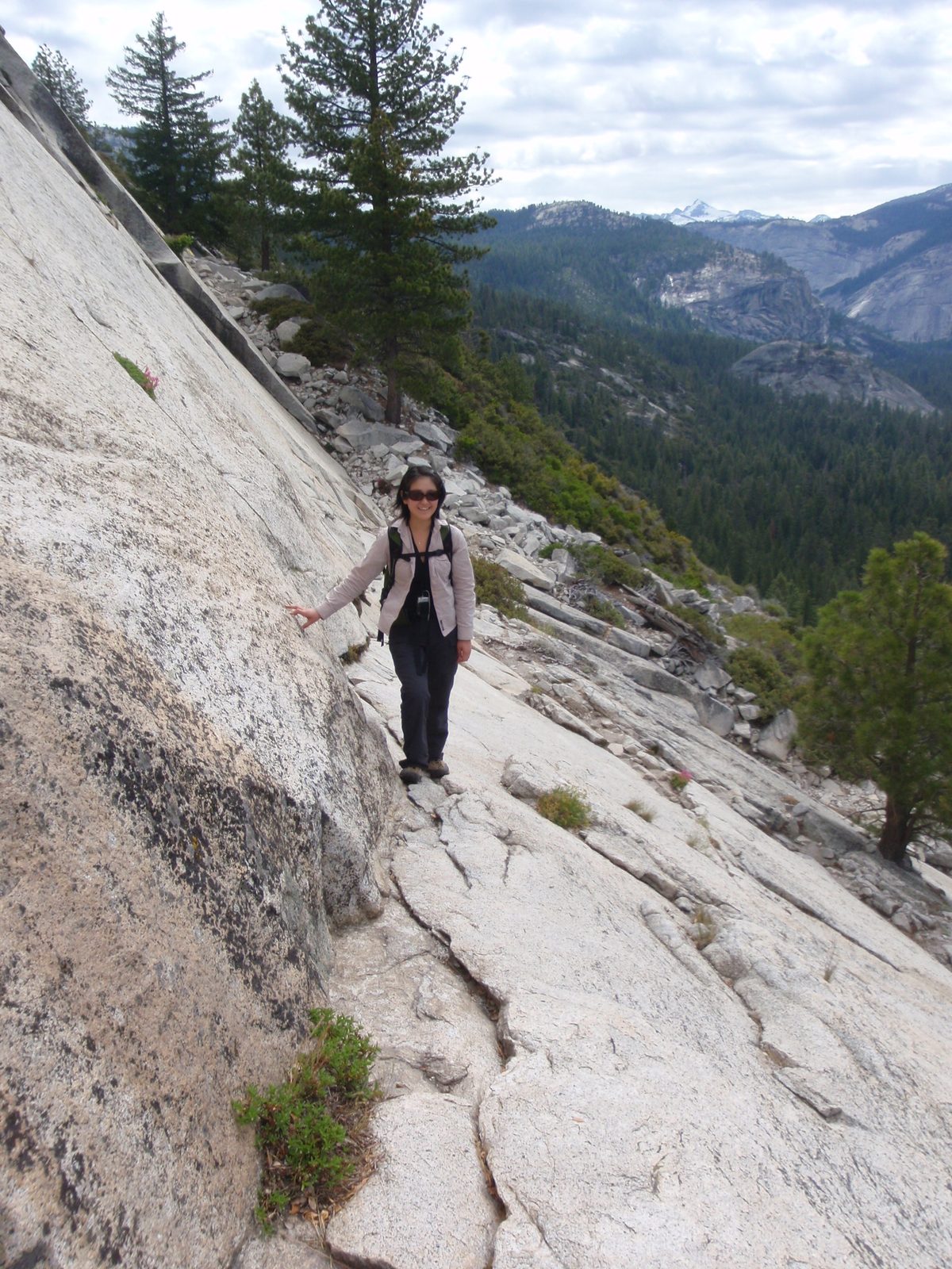 Monica tiptoeing carefully across the exposed ledge.