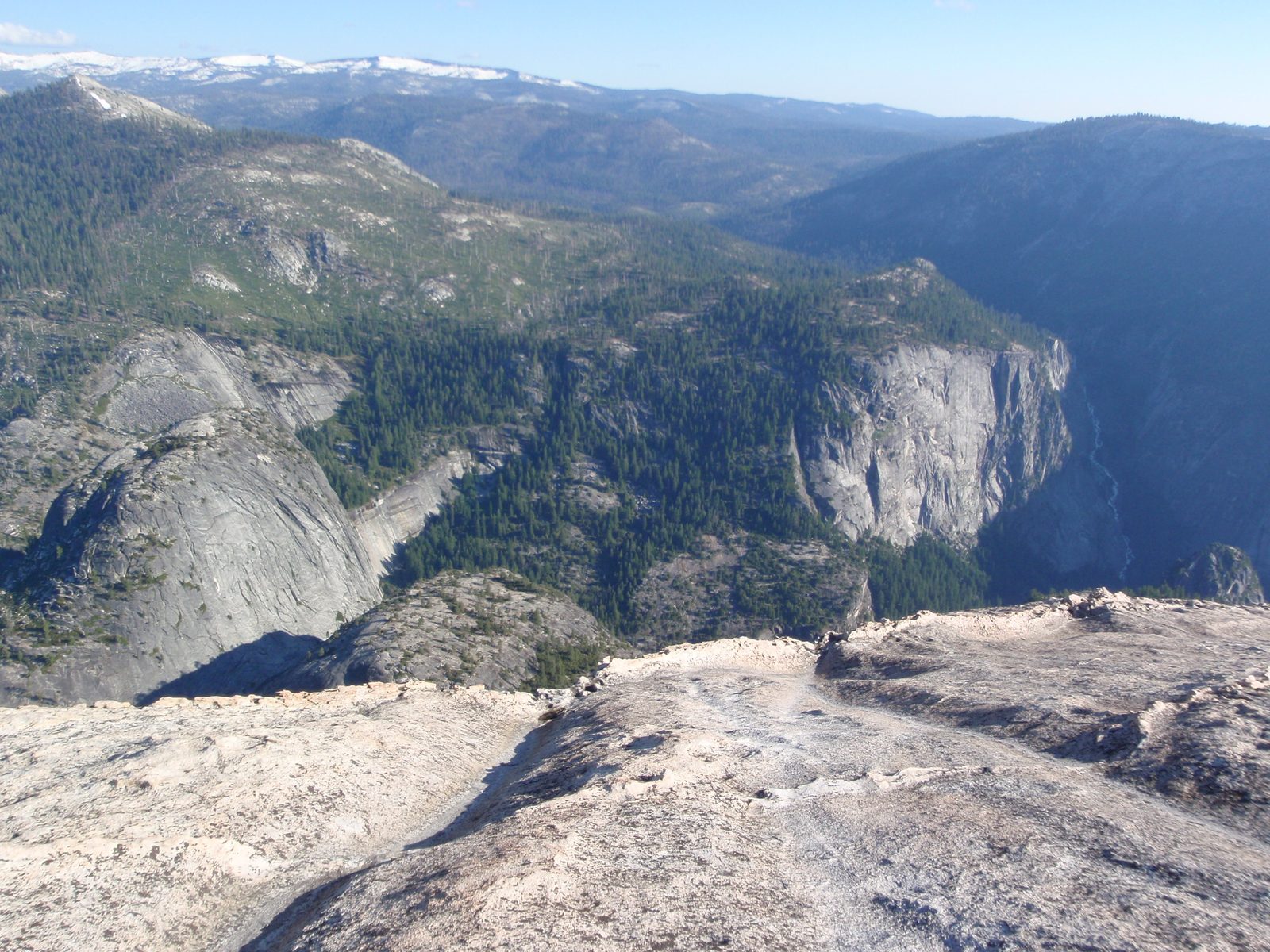 Thousands of years of rain coursing down half dome has eroded water channels into the granite...