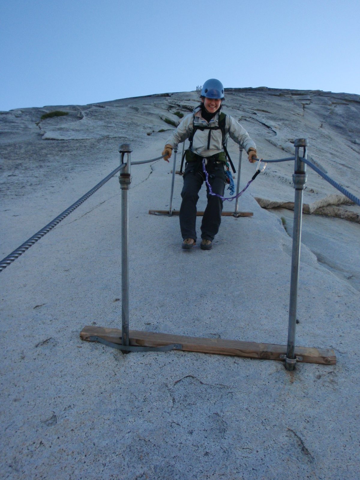 Monica scurries down the last few stanchions on the cables. It's a little less steep now.
