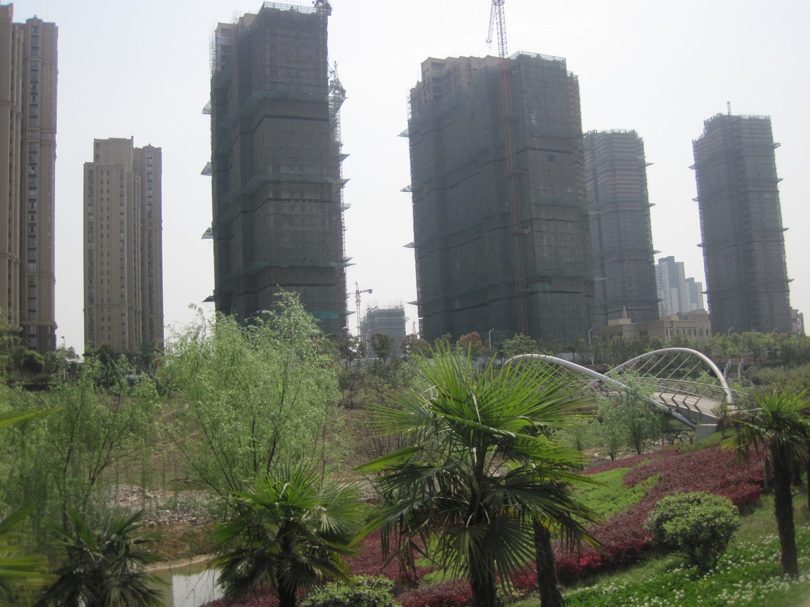 View of the park and the exquisite taste of life of small farmers condo complex under construction.