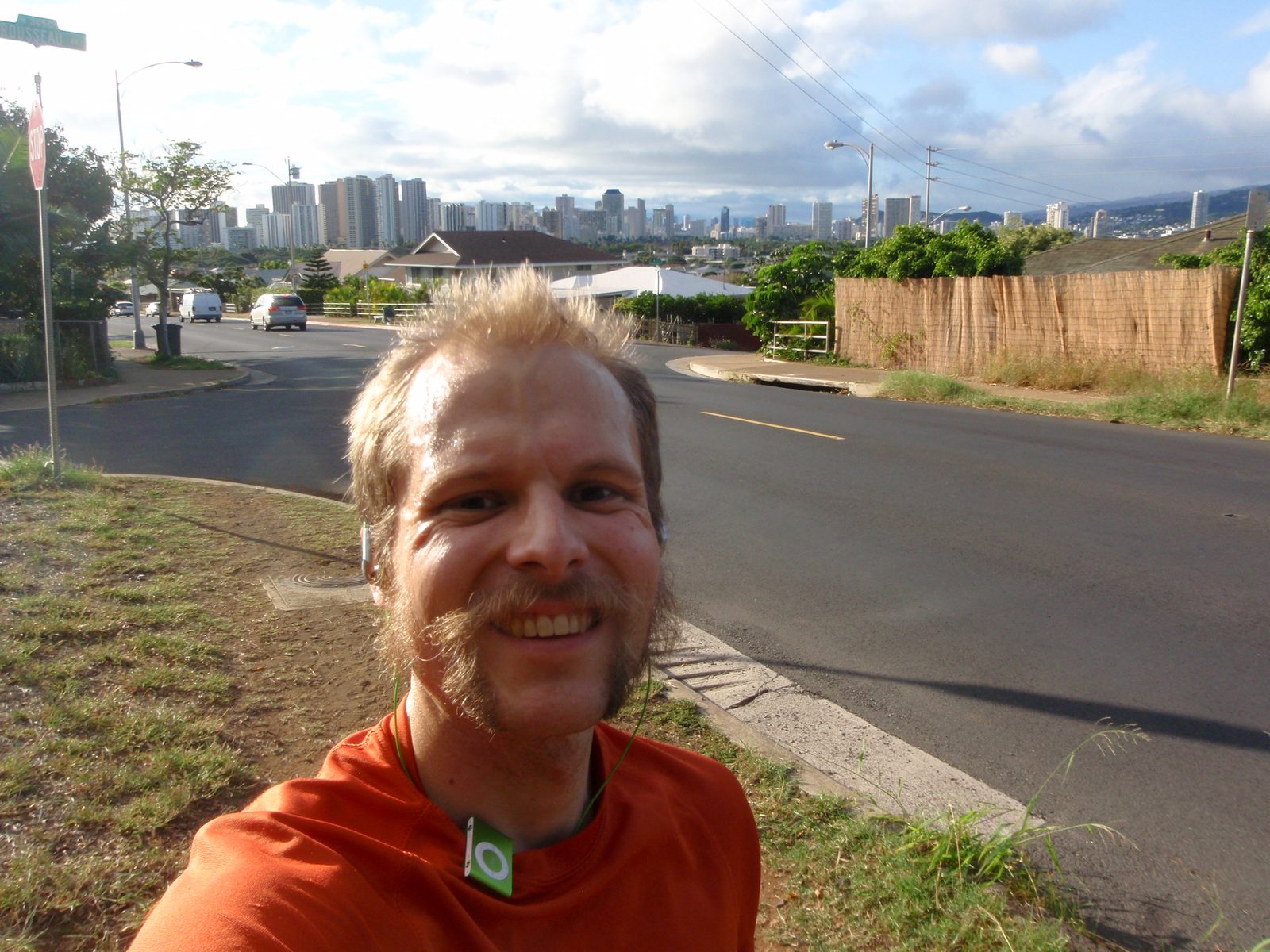 John, running in Lydia's neighborhood, with the Honolulu skyline in the background to the southwest.