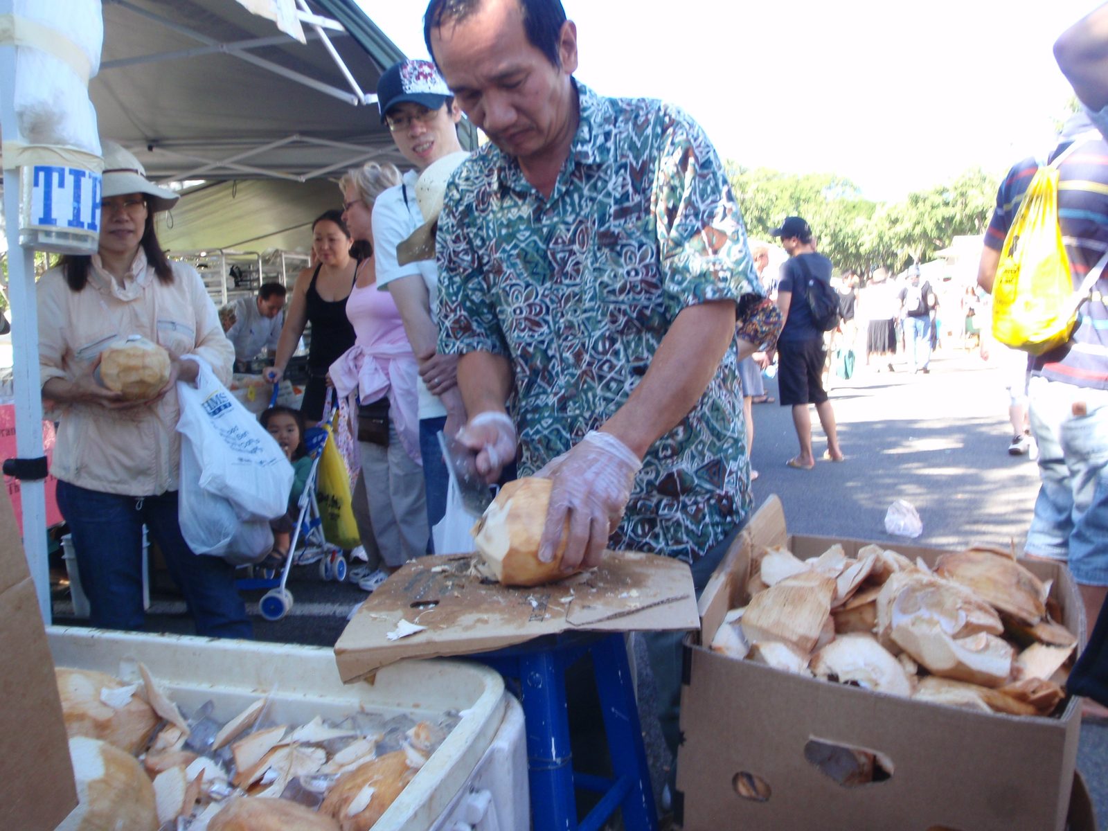 Lydia and I also bought a young fresh coconut, which this man opened for us to drink.  Sadly, he...