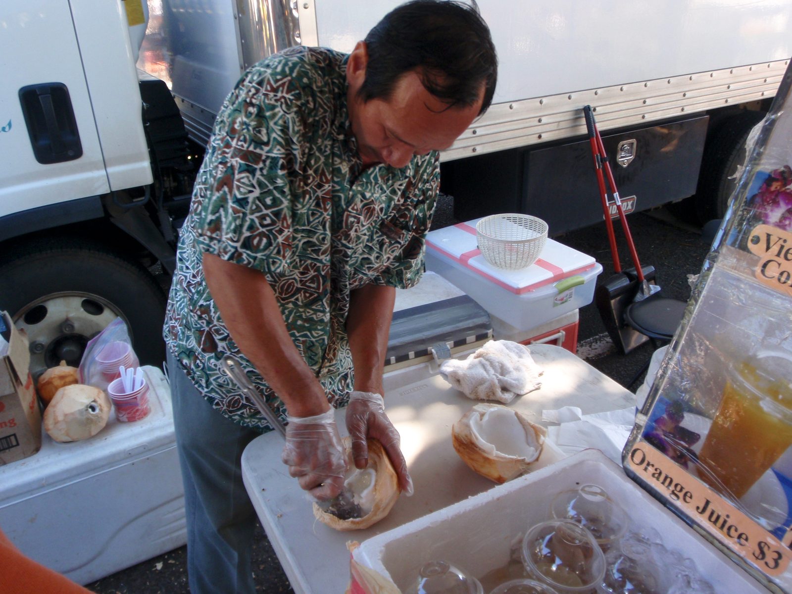 But then when we were done, we took the coconut back to him, and he cut it open and scooped the...