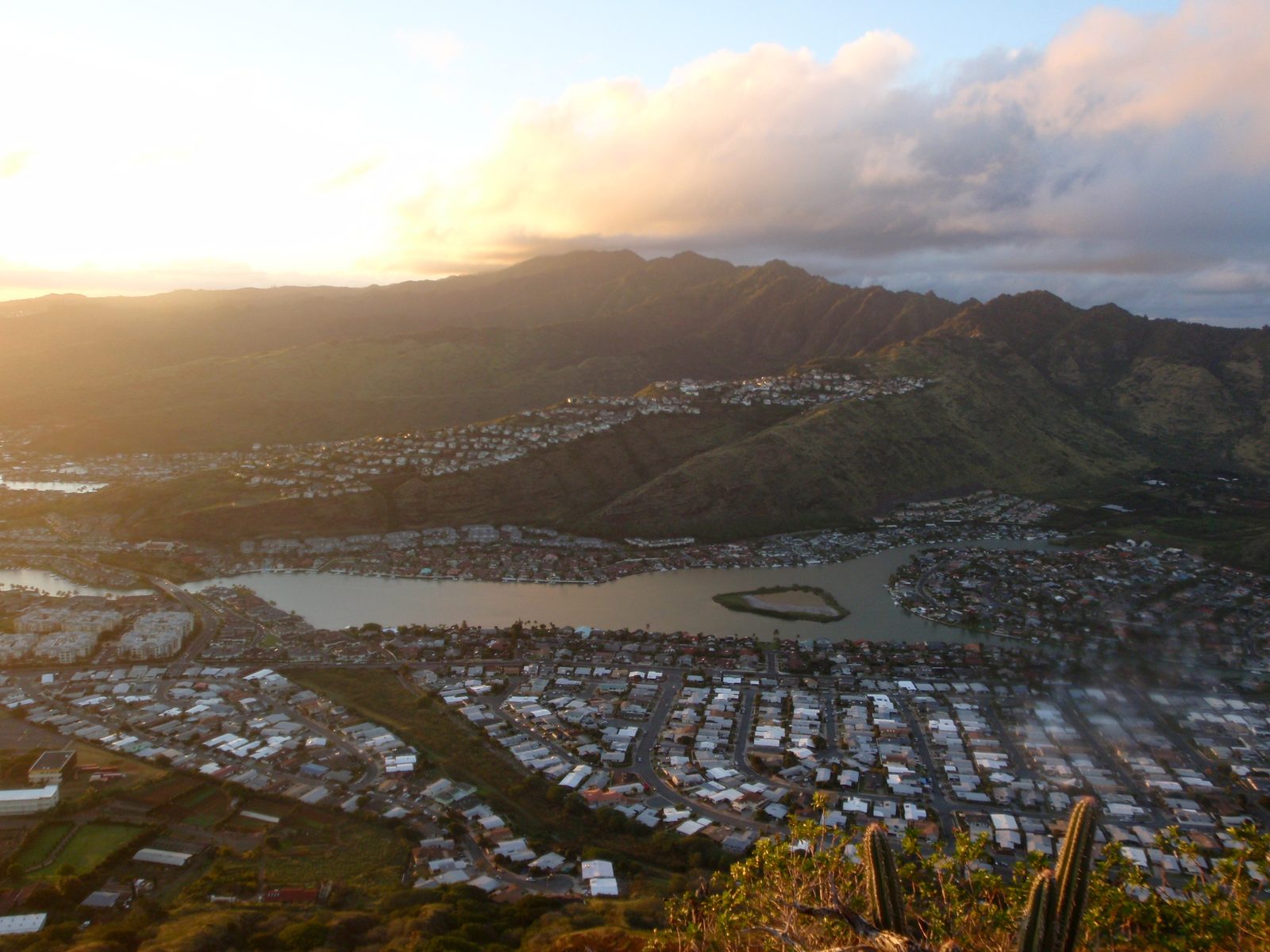 View west across a good part of Oahu.  Clouds descending on the highest peaks while the valleys...