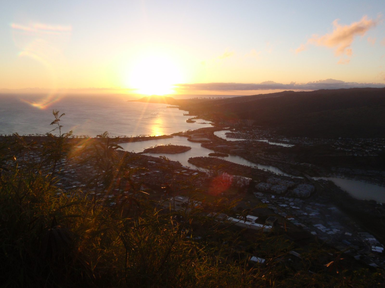 Sunset over Diamond Head, downtown Honolulu slightly to the right.