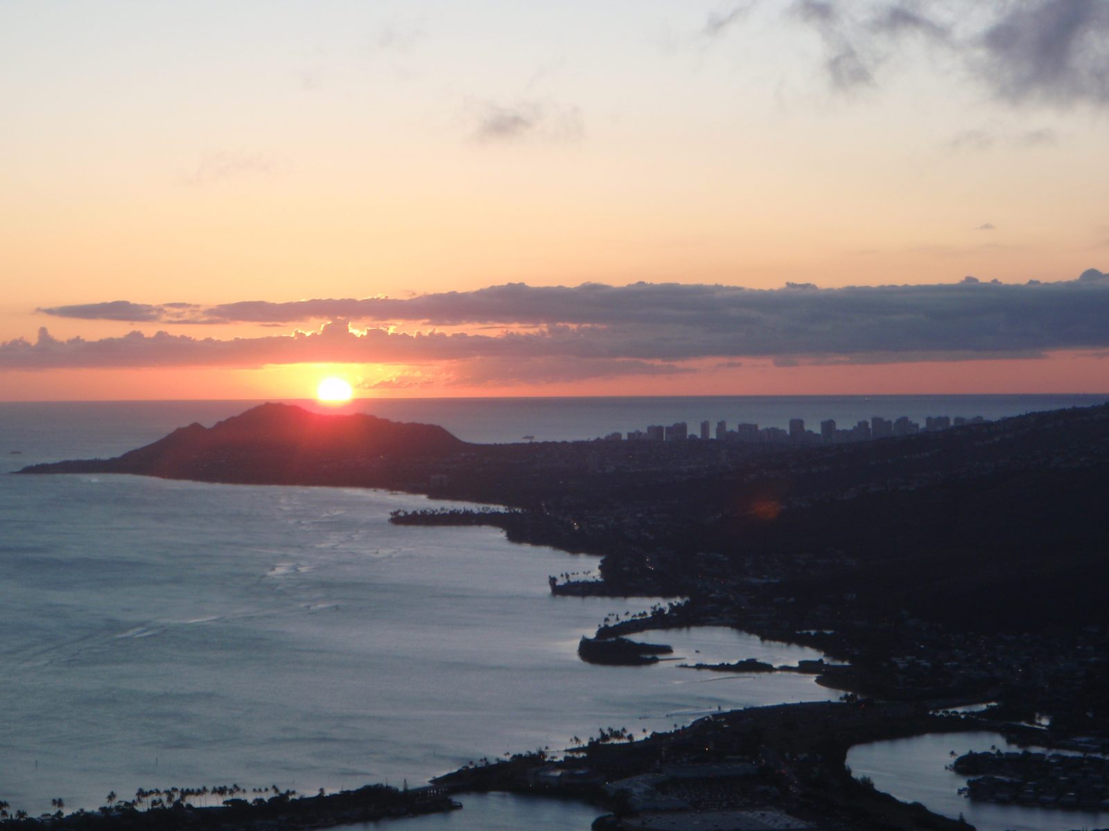 Diamond Head, Honolulu and the sun.