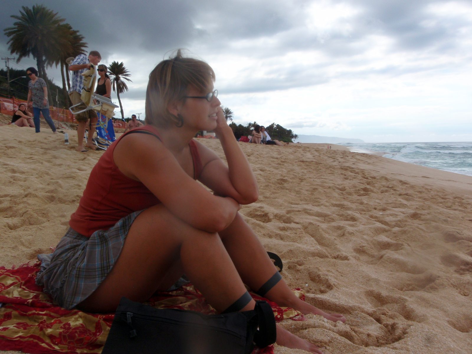 Lydia watching surfers in the pounding surf of the north shore of Oahu.