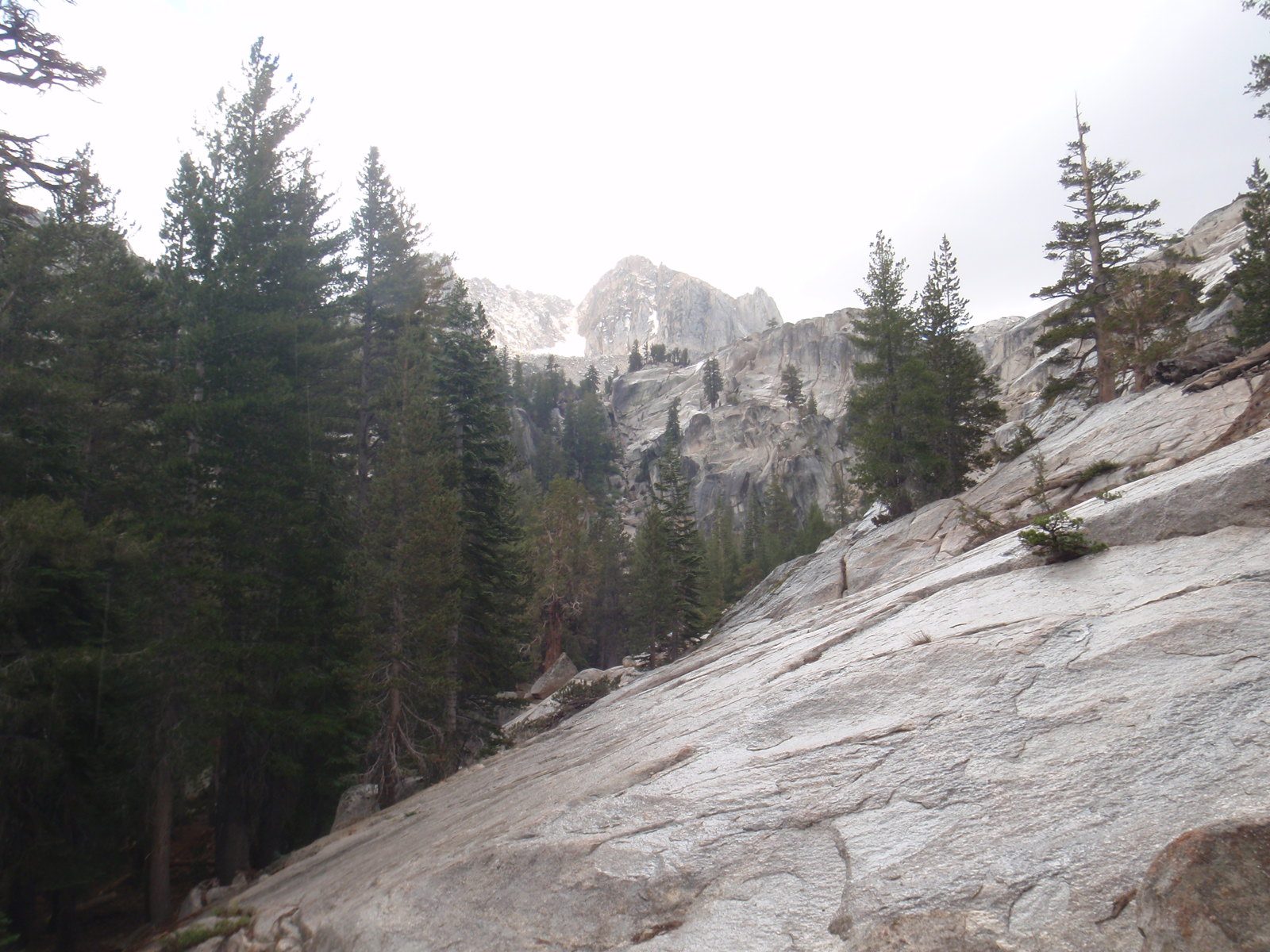 Our view disappeared and granite quickly became slickrock. While we even got pelted with hail a...