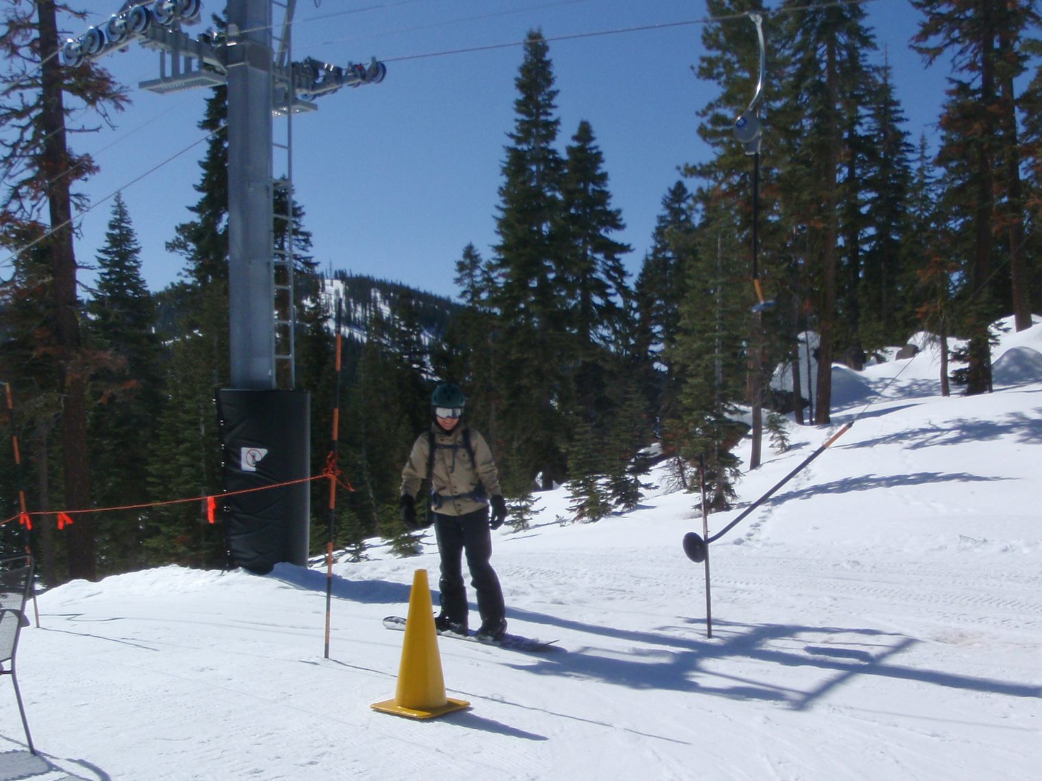 Monica rides her first t-bar lift.  Turns out this is a little bit trickier on a snowboard than...