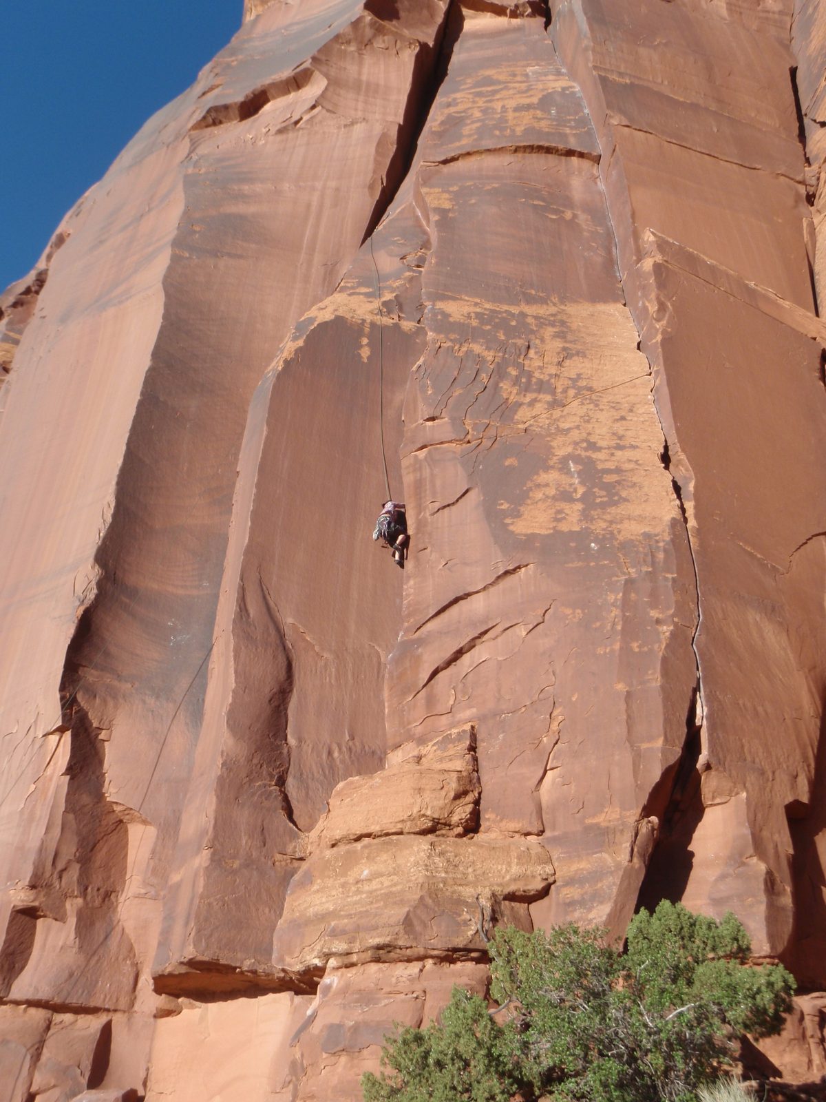 The route involved jamming hands and fists into a dihedral crack that eventually widened into a pod.