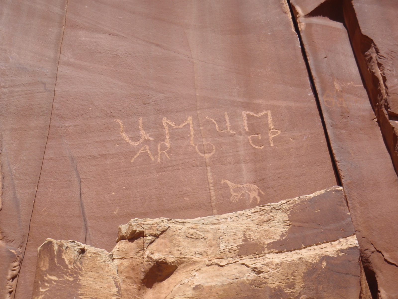A petroglyph and somebody's tag.