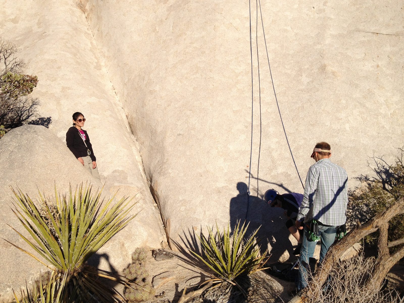 John belaying on a much easier slab climb while Monica watches from the left.