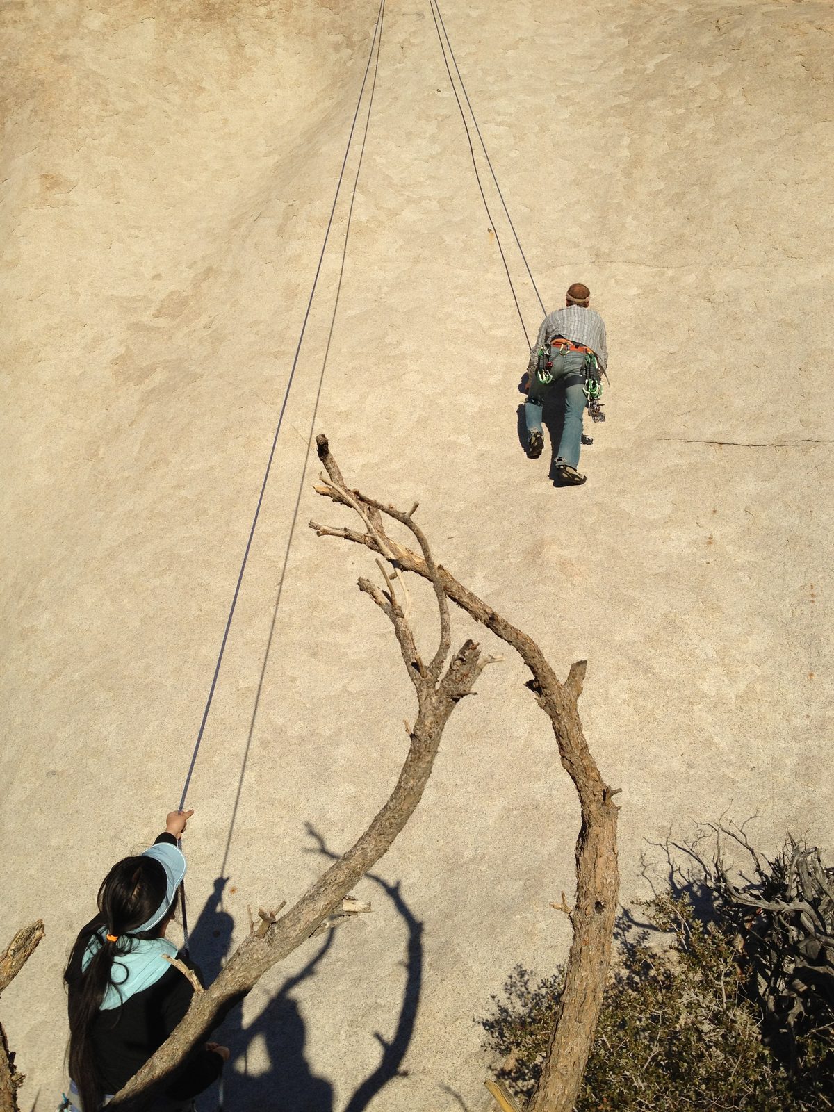 John climbing some unnamed slab on crumbling dime edges while Sharon belays.