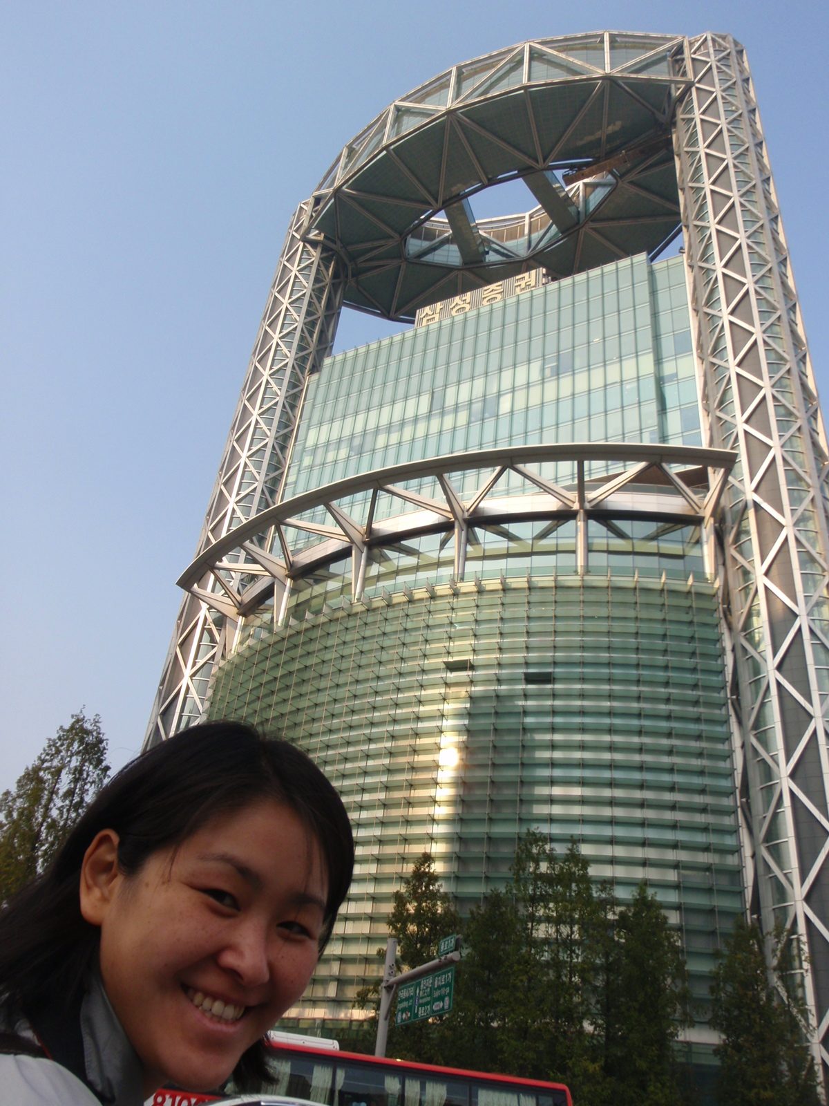 Monica in front of Jongno Tower, one of the more distinctive commercial buildings in Seoul.