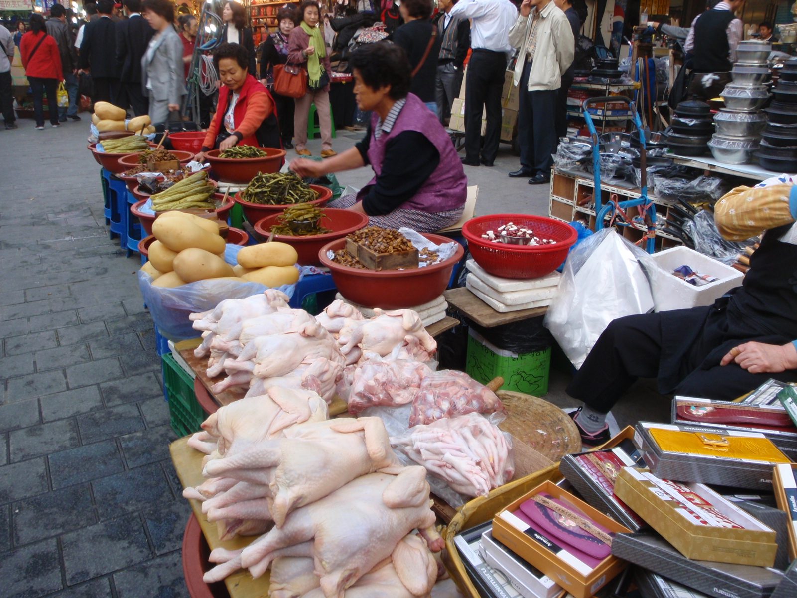 Chickens and veggies for sale.
