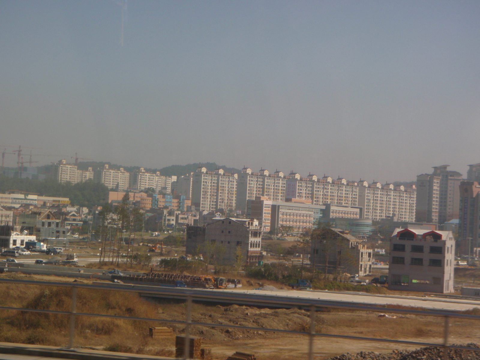 A typical view out the window while crossing the "rural" interior of Korea.  Cookie-cutter...