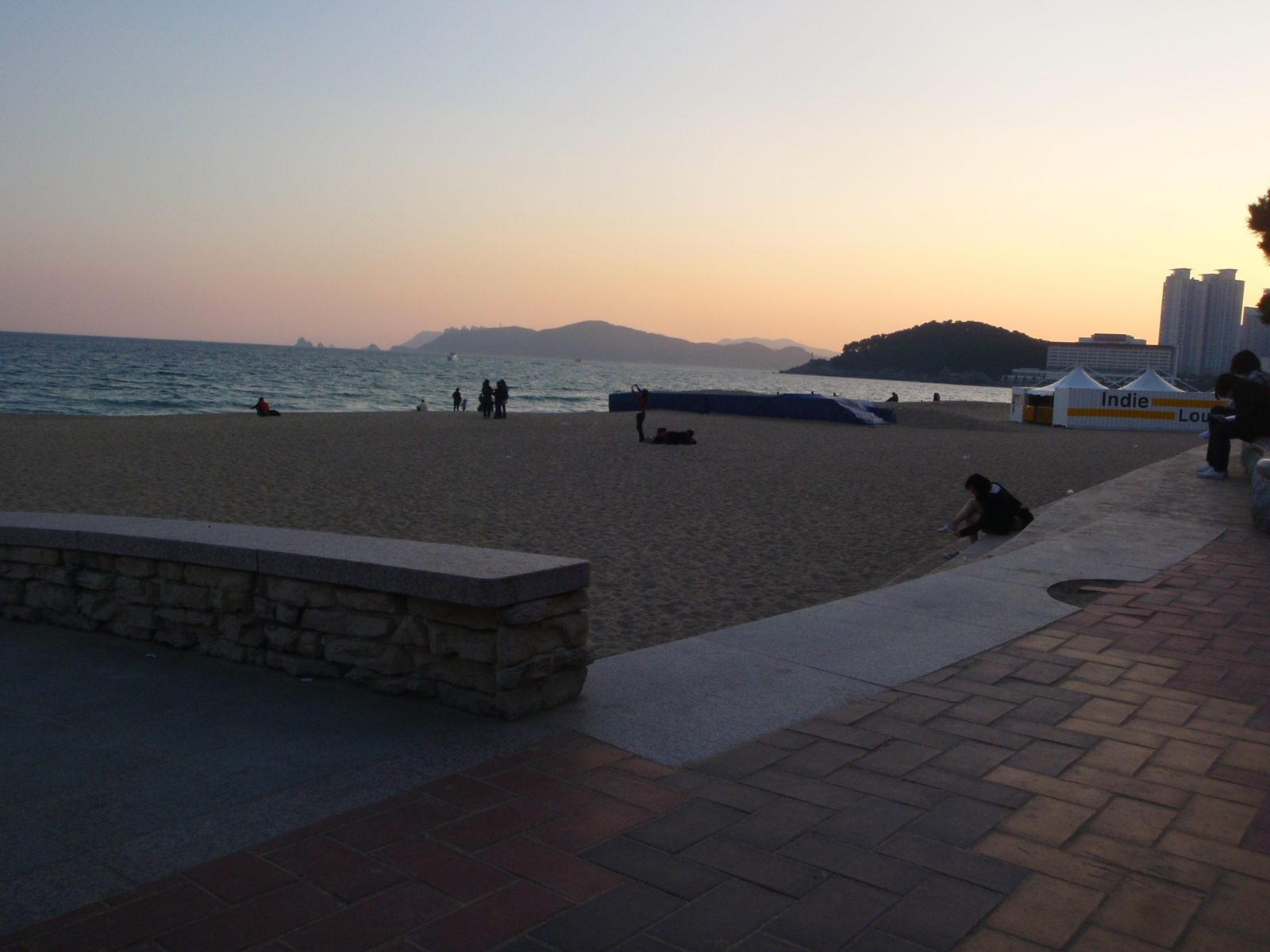 Sunset over Haeundae beach in Busan.  Time to head back home.  Directly above the while tent is...