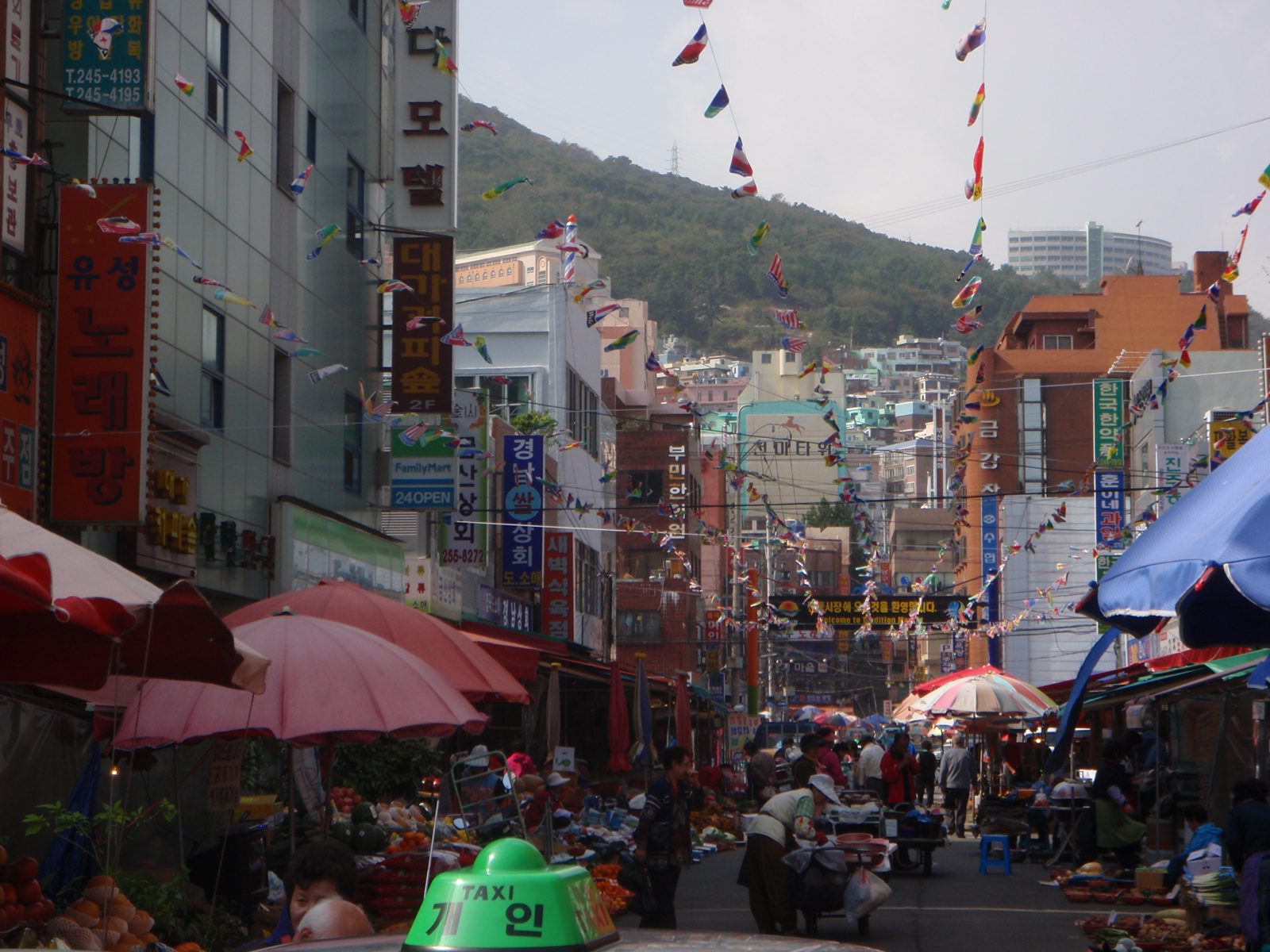 Another busy street filled with stalls.
