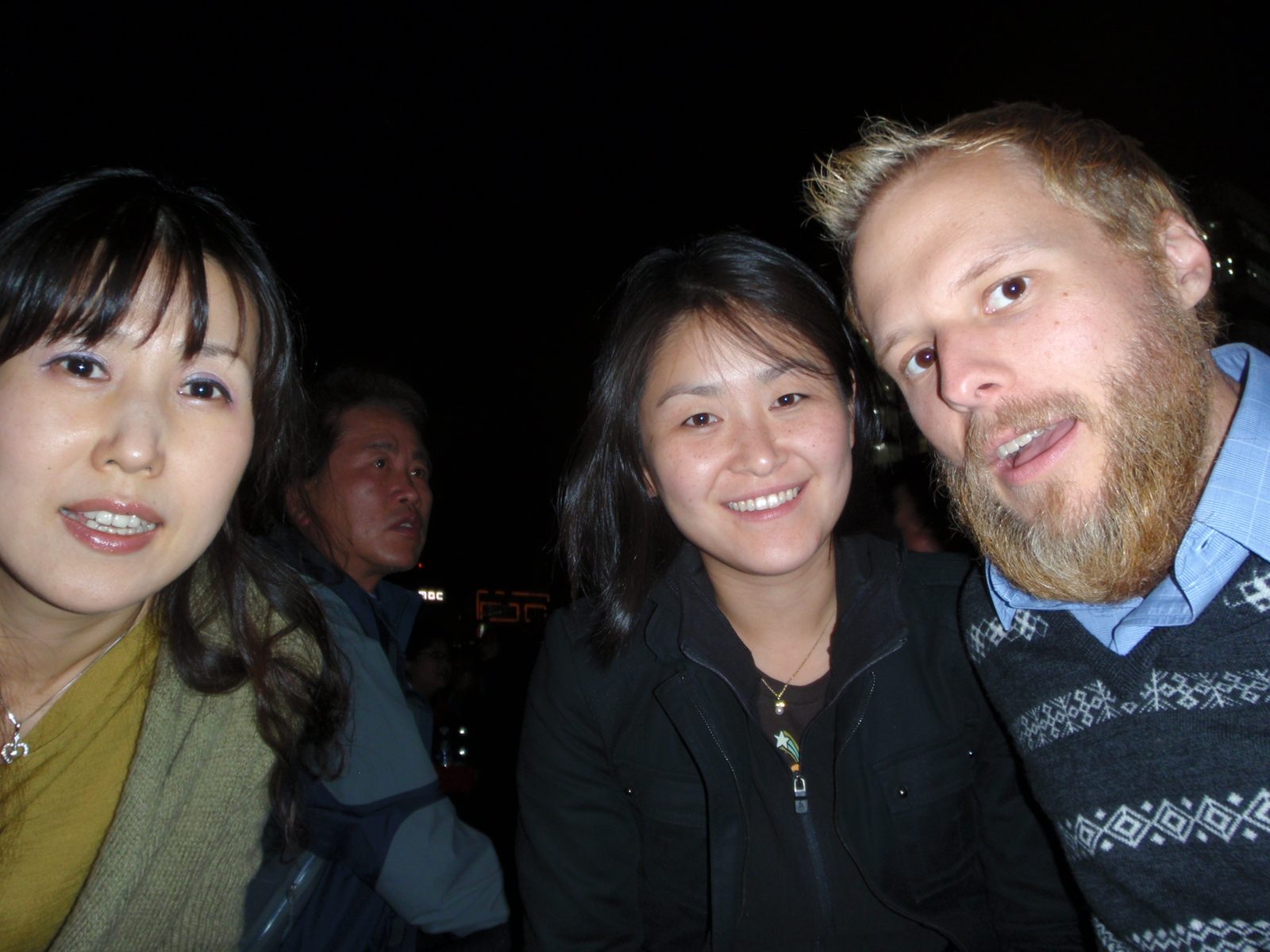 Ji-Young, Monica and John watching the fireworks.  I think this is a self portrait with a flash.