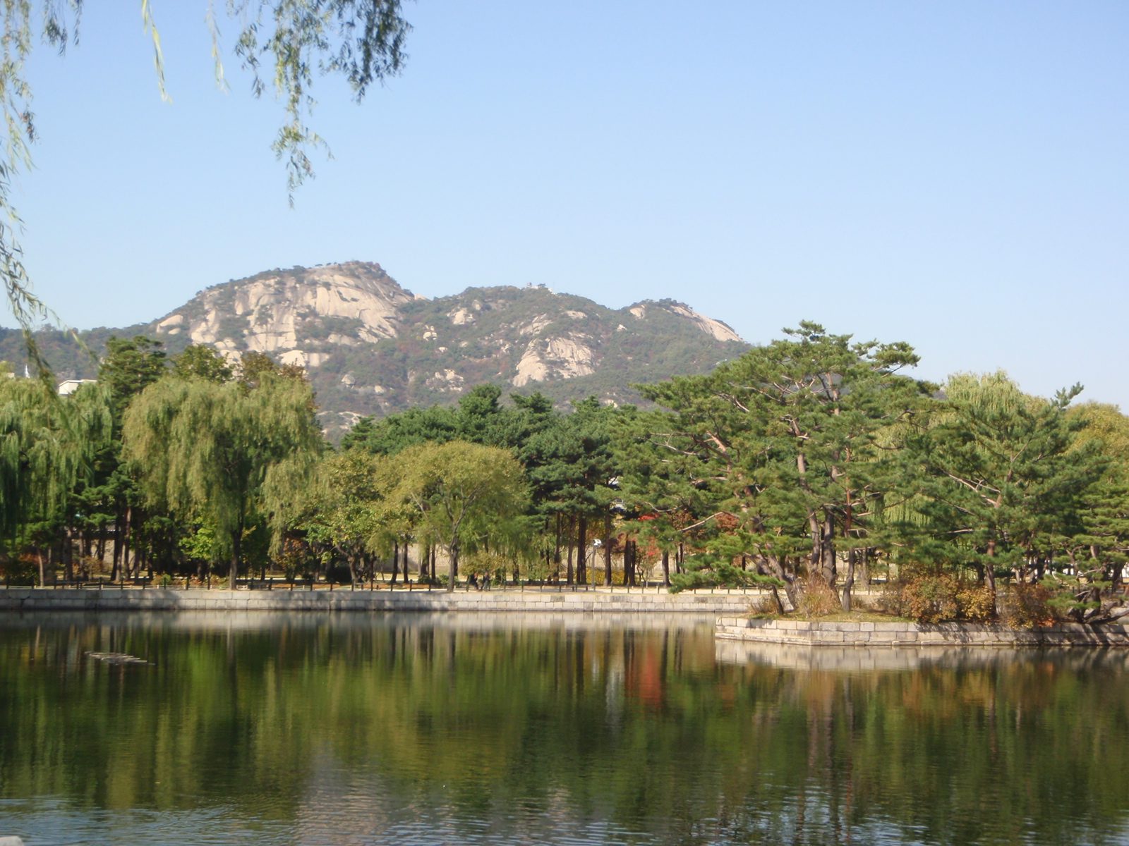 Moat/reflection pond surrounding one palace building.