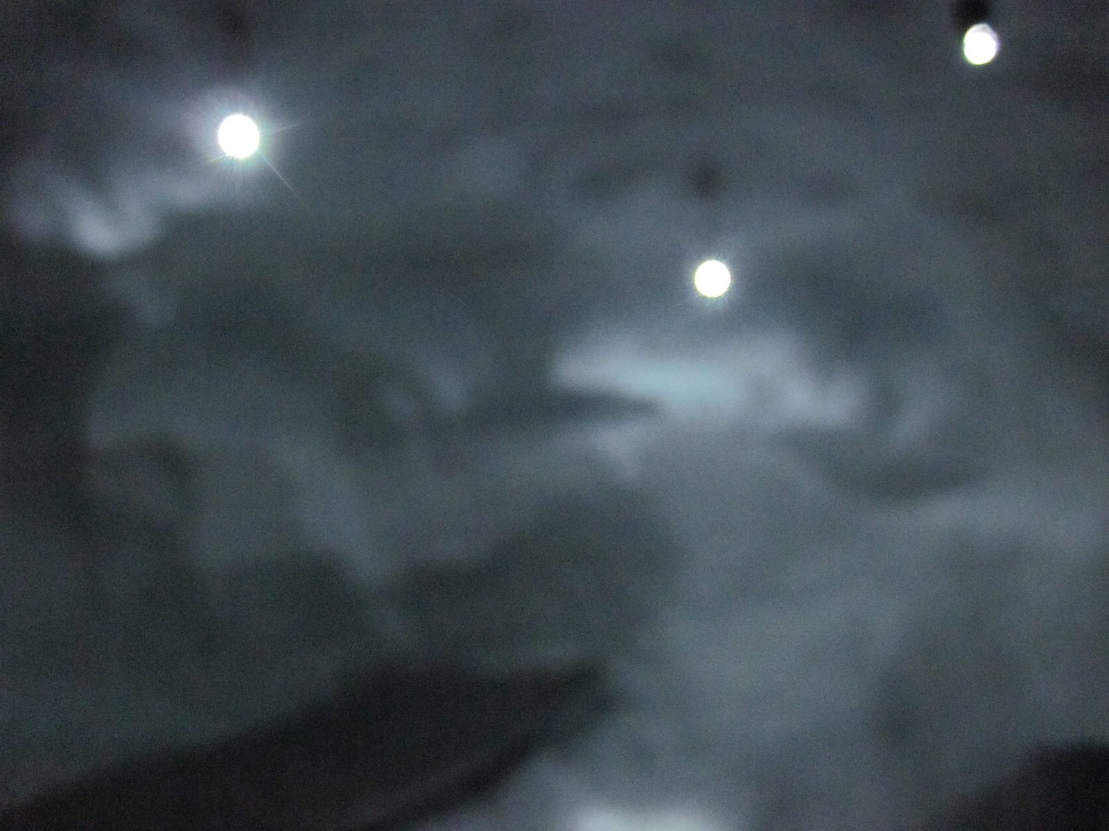 Monica tries to take a photo without flash to capture our LED lighting. Light filters through...