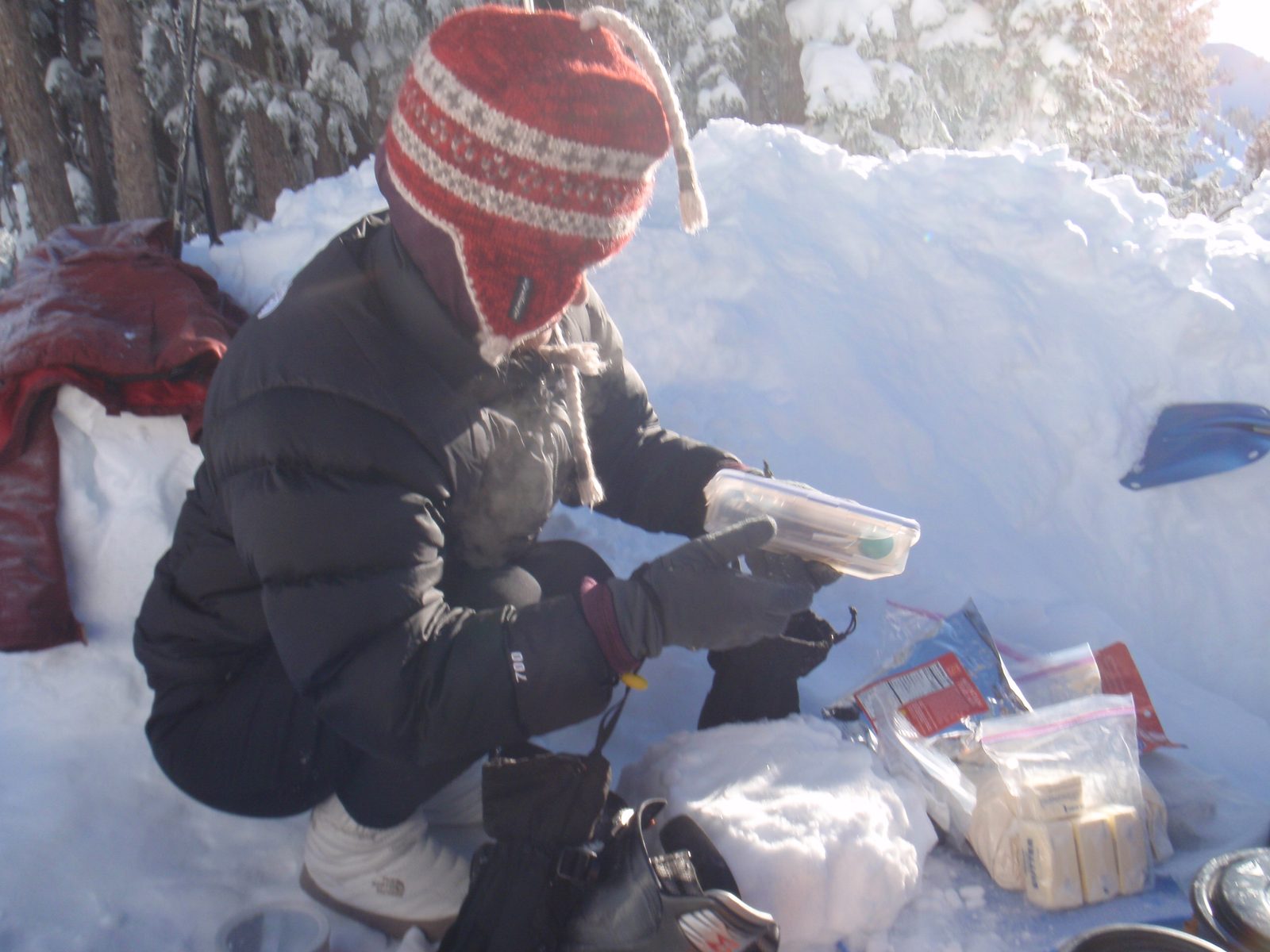 In camp the next day, Monica helps prepare breakfast. Note the pound of butter at lower right....
