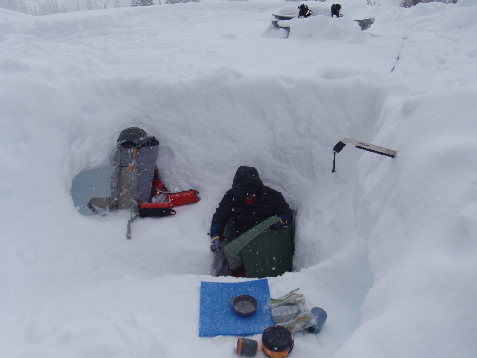 Zoomed out shot showing our chimney, capped with some snowboards to keep the drafts down and snow out.