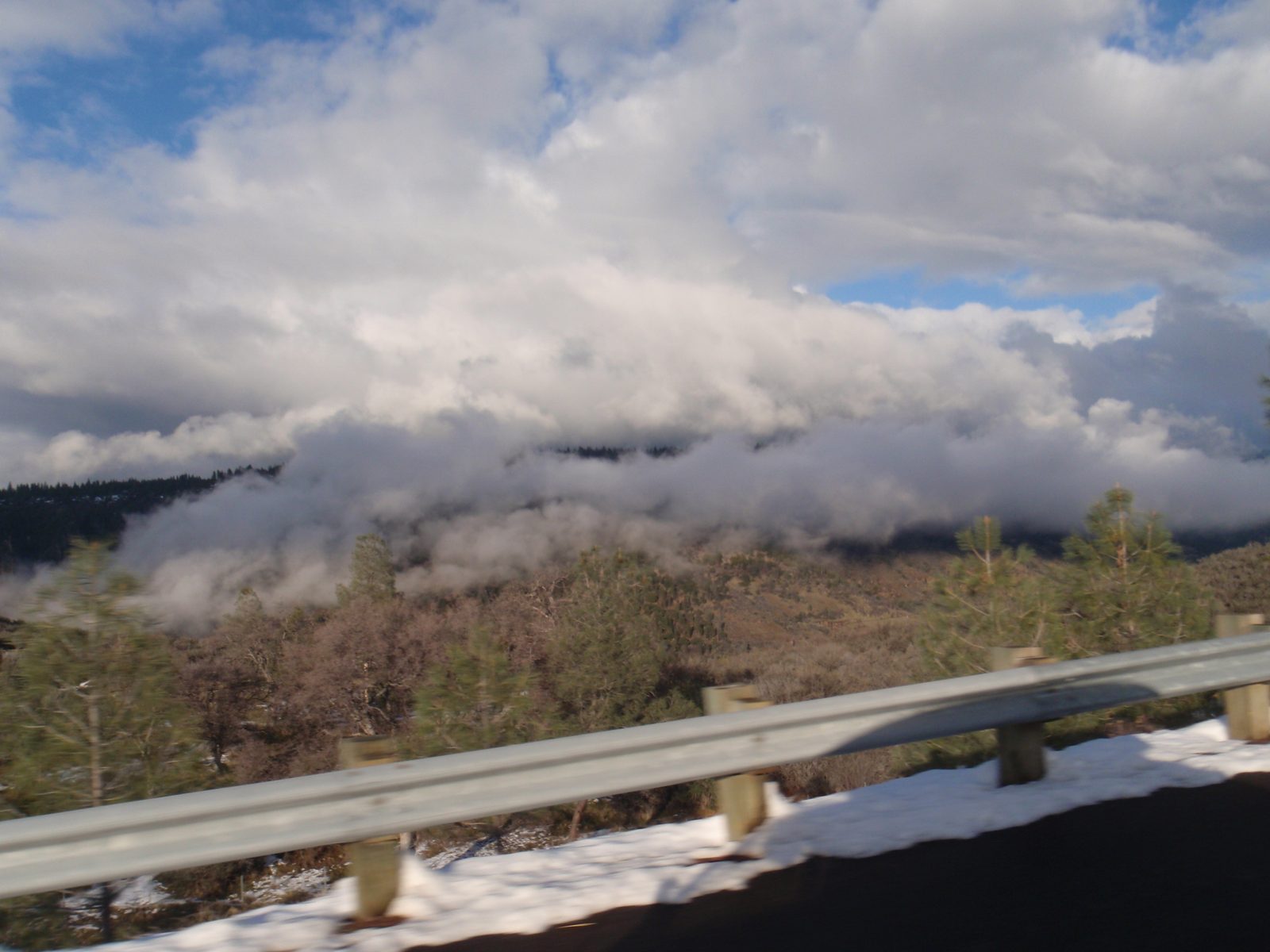 Crazy clouds driving down from the mountains on the road to Red Bluff.