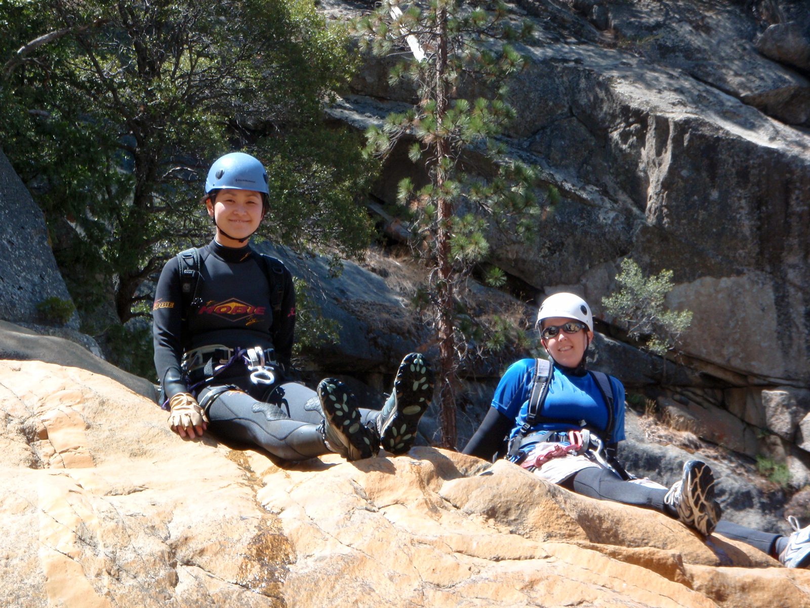 Monica and Catherine sun out on a rock by the side of the stream.  Despite wet suits and very...
