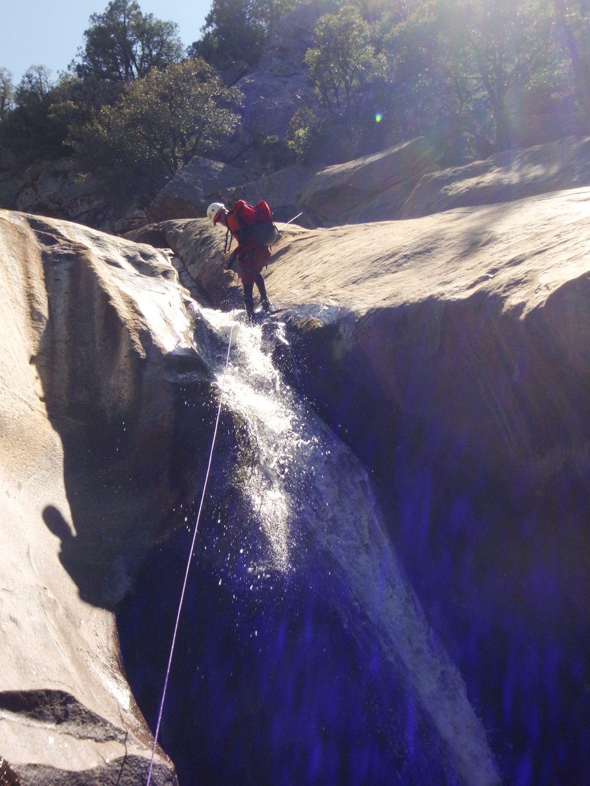 John, on Catherine's suggestion, takes a variation on the second rappel through a small waterfall.